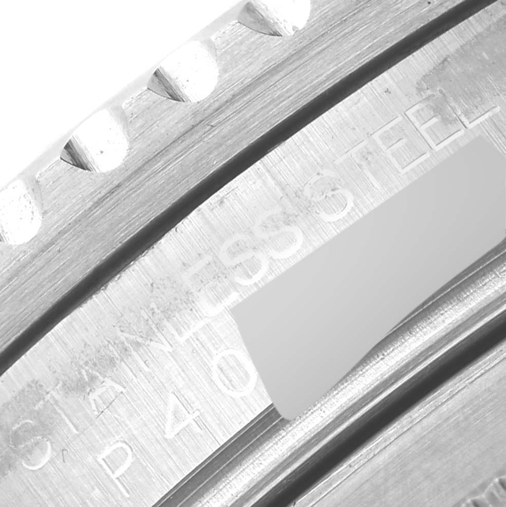 The image shows a close-up angle of the bezel and part of the case of a Rolex GMT-Master 16710 Men
s Stainless Steel Black Dial 16710 Men
s Stainless Steel Black Dial watch, highlighting the stainless steel inscription.