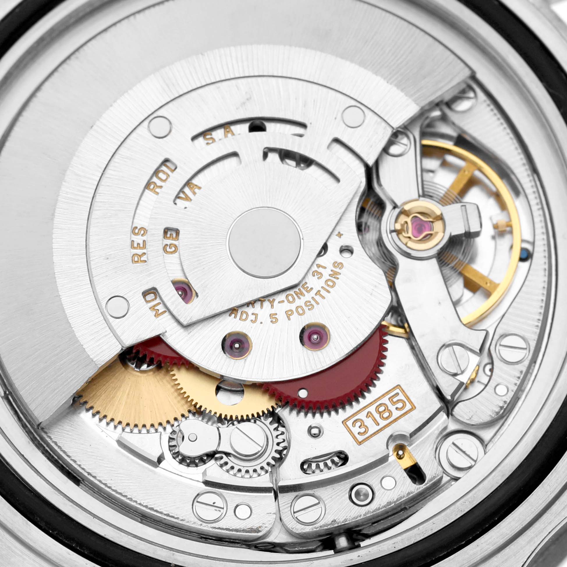 This is a close-up view of the intricate movement parts of a Rolex GMT-Master 16710 Men
s Stainless Steel Black Dial 16710 Men
s Stainless Steel Black Dial watch, showing gears and mechanical components.