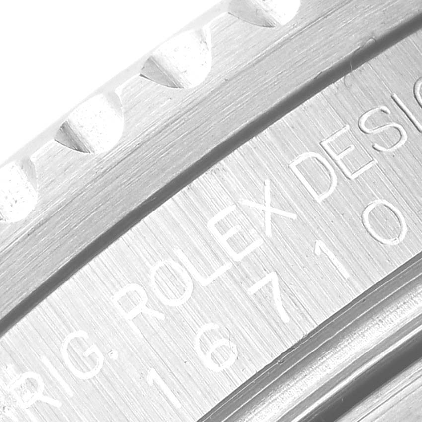 This close-up image shows the engraved side bezel and case of a Rolex GMT-Master 16710 Men
s Stainless Steel Black Dial 16710 Men
s Stainless Steel Black Dial watch.