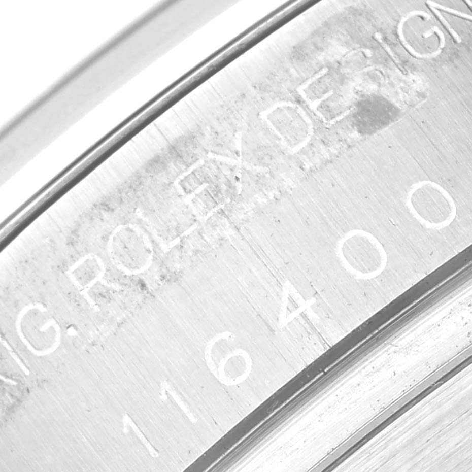 This close-up image shows the engraving on the inner bezel of a Rolex Milgauss 116400 Men's Stainless Steel Black Dial 116400 Men's Stainless Steel Black Dial watch.