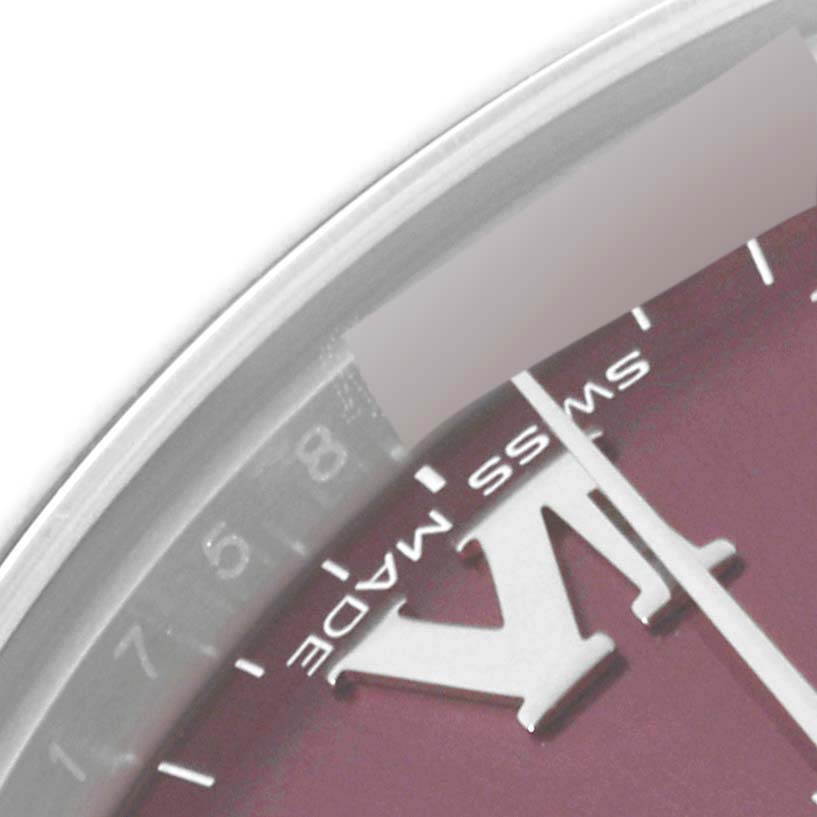 The image shows a close-up of the Rolex Mid-Size 177200 Women's Stainless Steel Purple Dial 177200 Women's Stainless Steel Purple Dial watch dial, highlighting part of the hour markings and the Swiss Made text.
