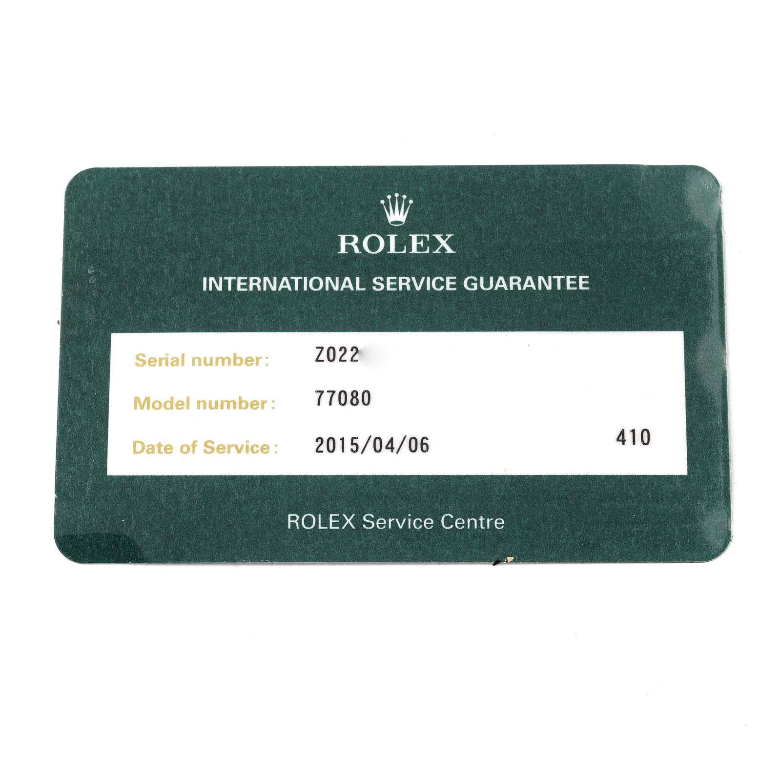 The image shows an International Service Guarantee card for a Rolex Mid-Size 77080 Women
s Stainless Steel Pink Dial 77080 Women
s Stainless Steel Pink Dial model with model number 77080 from a Rolex Service Centre.