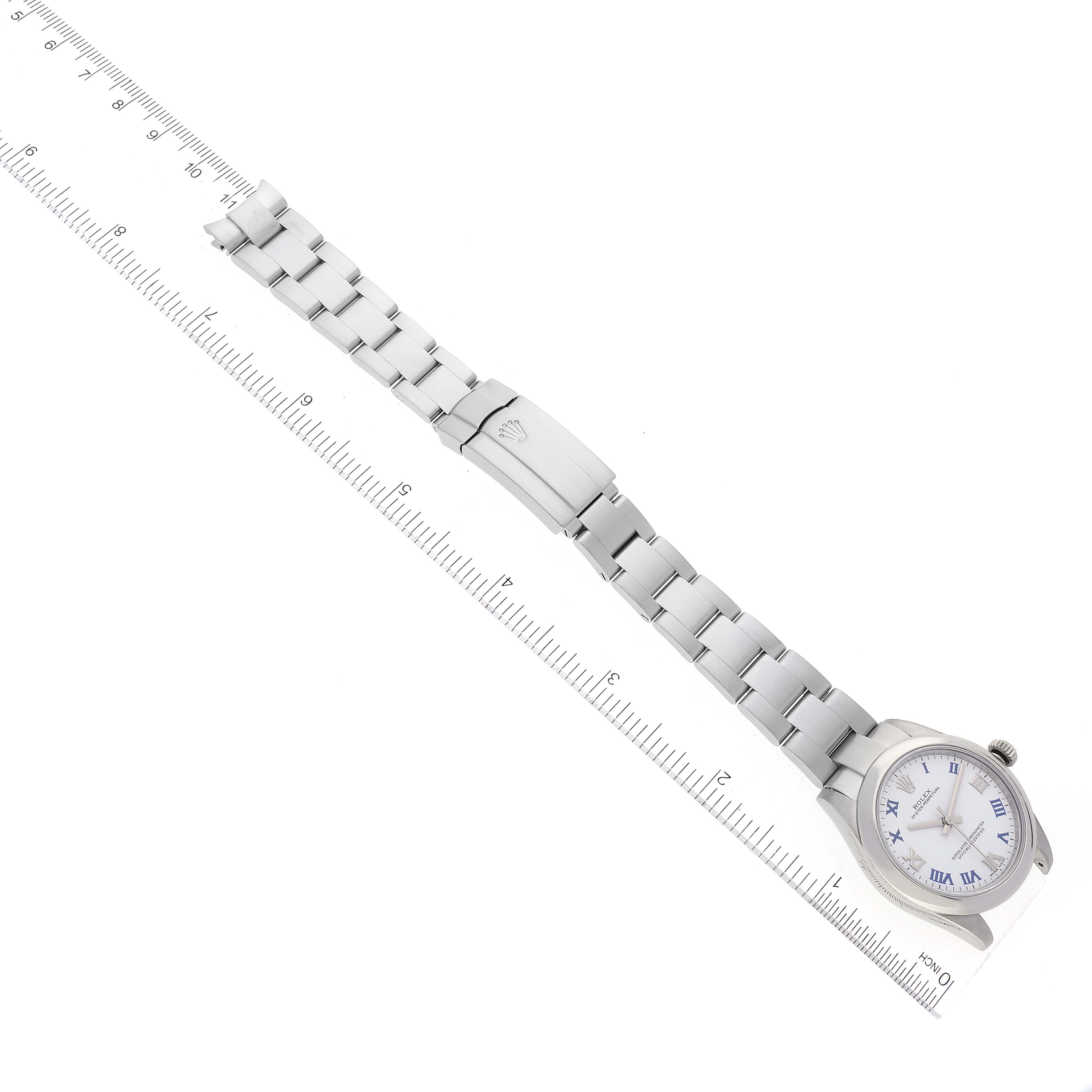 The image shows a top-down view of a Rolex Mid-Size 177200 Women's Stainless Steel White Dial 177200 Women's Stainless Steel White Dial model watch with a focus on the face, bracelet, and clasp.