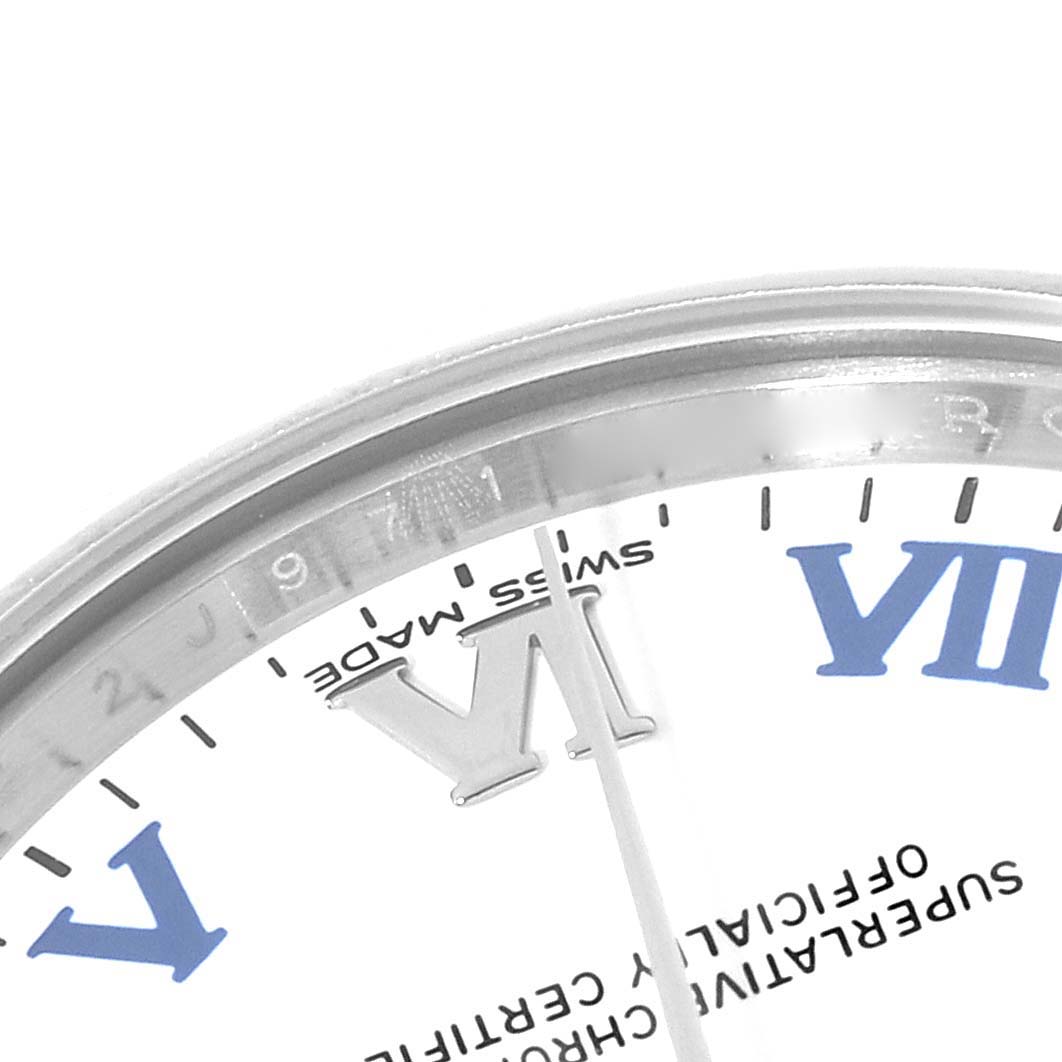 The image shows a close-up of the dial, bezel, and part of the second hand of a mid-size Rolex watch.