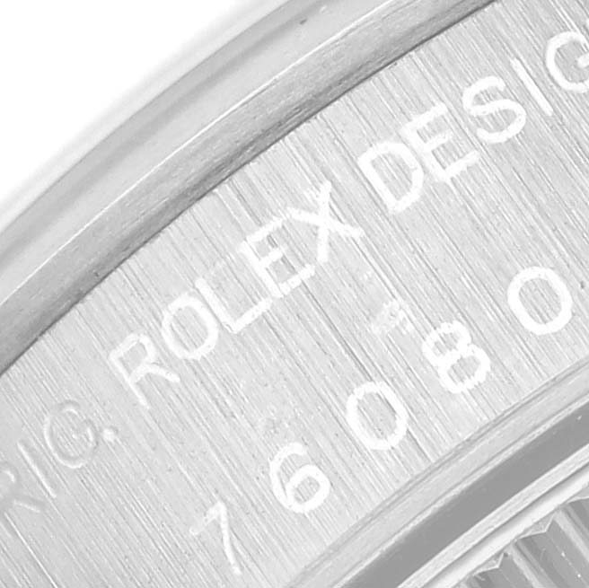 This image shows a close-up of the case back of a Rolex Oyster Perpetual 76080 Women's Stainless Steel Silver Dial 76080 Women's Stainless Steel Silver Dial watch, highlighting the engraved text.