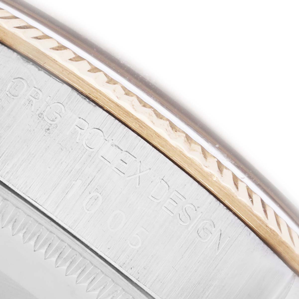 The image shows a close-up of the side and bezel detailing of the Rolex Vintage Collection 1005 Men's Steel and Gold (two tone) Champagne Dial 1005 Men's Steel and Gold (two tone) Champagne Dial watch.