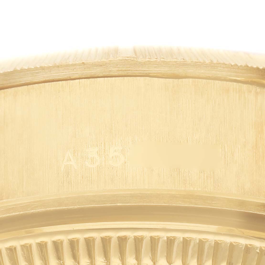 The image shows a close-up of the side and fluted bezel of a President model watch by Rolex.