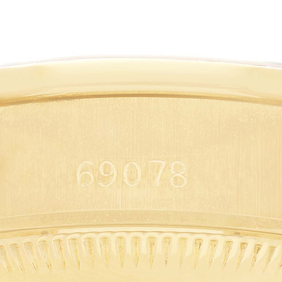 The image shows a close-up of the side of a Rolex President 69078 Women's Yellow Gold Champagne Dial watch case, highlighting the model number engraving.