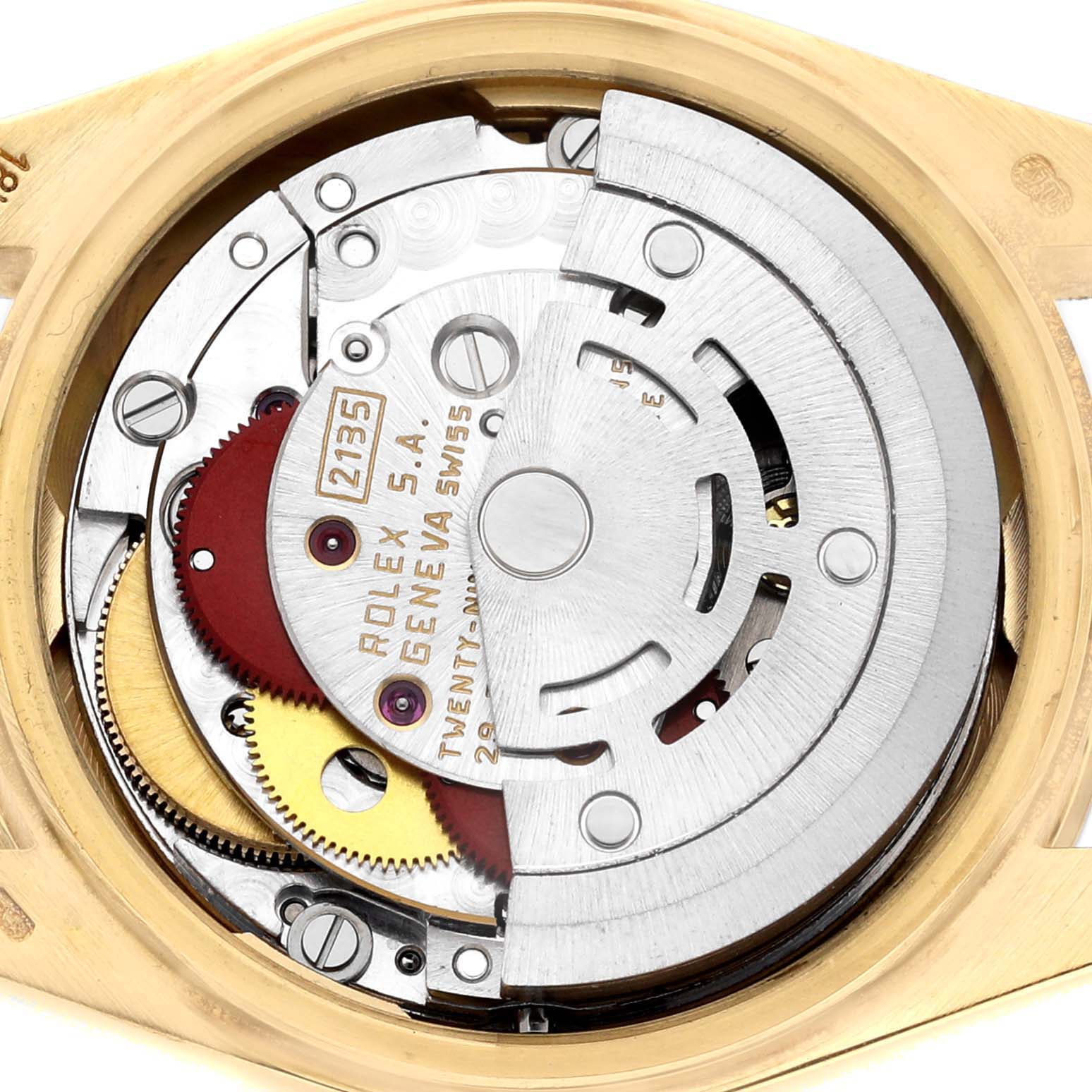The image shows the movement of a Rolex President 69078 Women's Yellow Gold Champagne Dial watch from a top-down angle, highlighting its intricate gears and components.