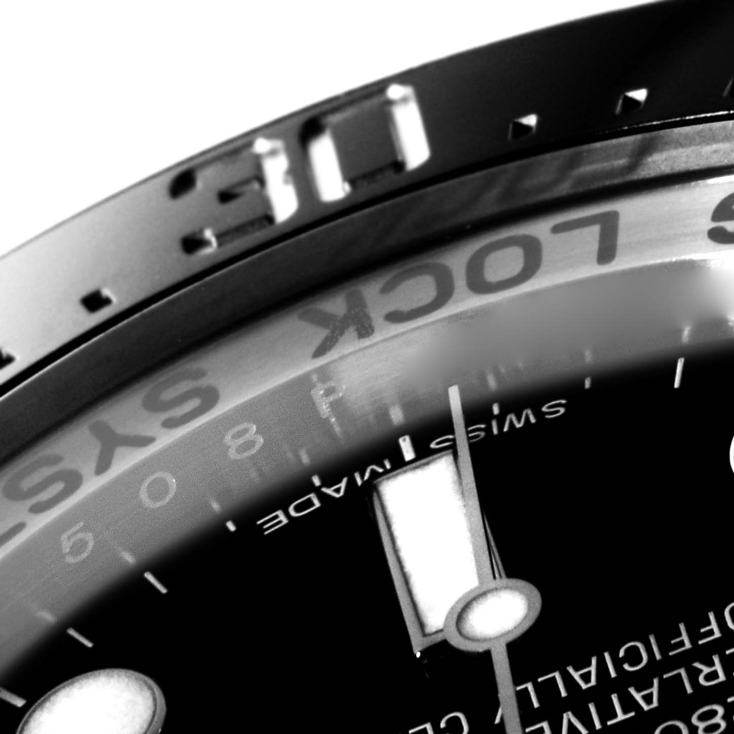 This close-up image of the Rolex Sea-Dweller 116660 Men
s Stainless Steel Black Dial 116660 Men
s Stainless Steel Black Dial shows part of the bezel and dial, including the "SWISS MADE" text.
