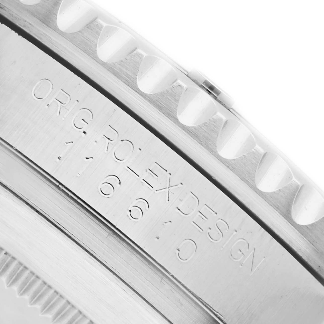 The image shows a close-up of the case side of a Rolex Submariner 116610LN Men's Stainless Steel Black Dial 116610LN Men's Stainless Steel Black Dial, highlighting the engravings.