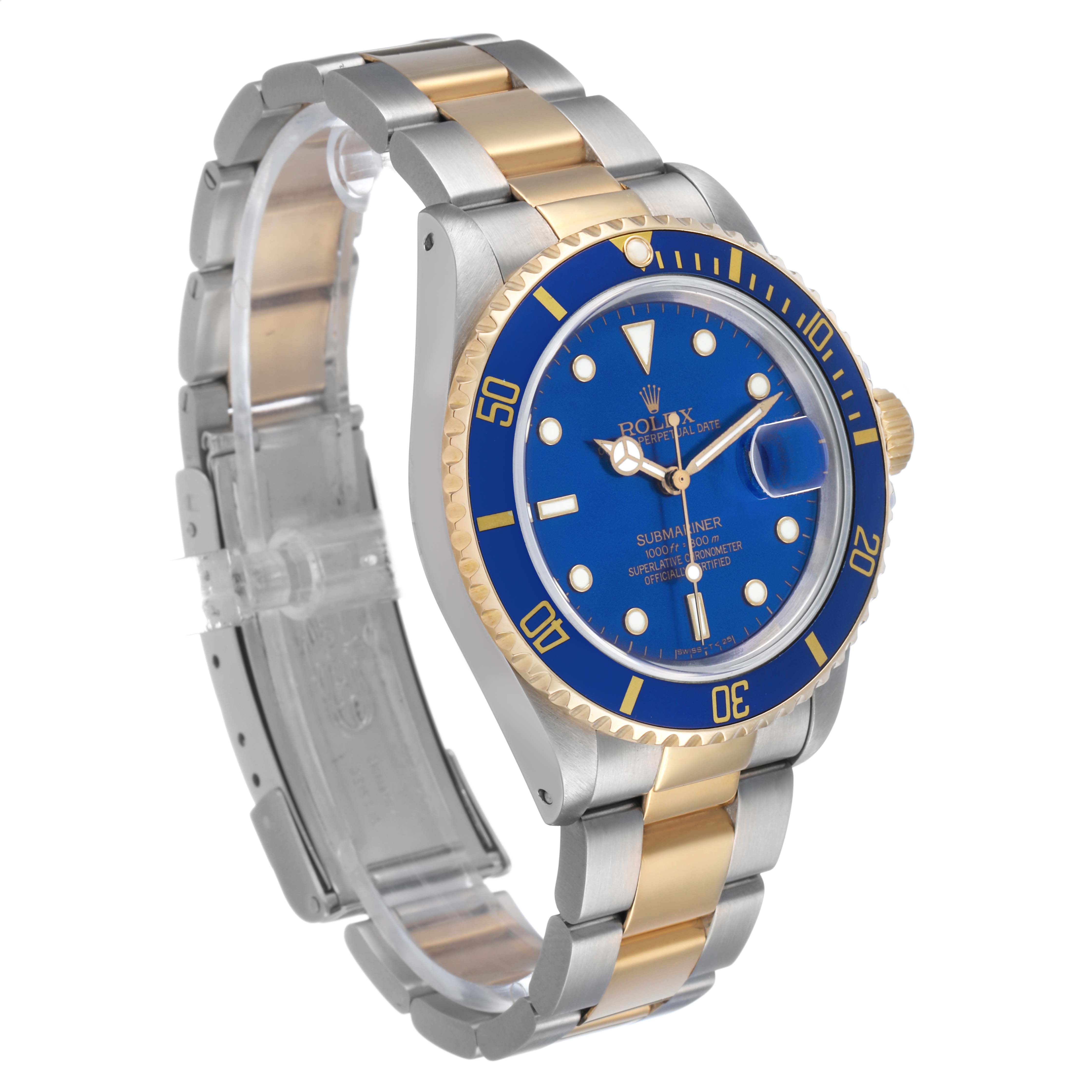 The Rolex Submariner 16803 Men's Steel and Gold (two tone) Blue Dial watch is angled to show the dial, bezel, and two-tone bracelet.