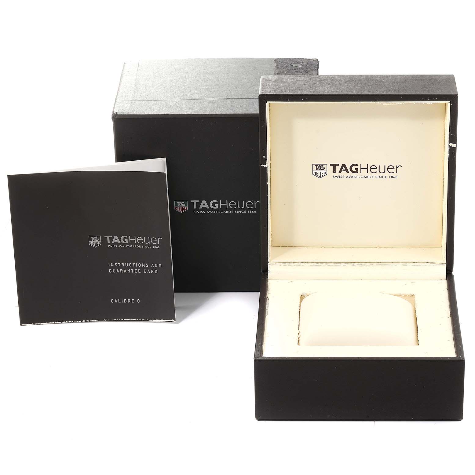 The image shows a Tag Heuer Carrera WAR5011.BA0723 Men's Stainless Steel Silver Dial WAR5011.BA0723 Men's Stainless Steel Silver Dial watch box, an instruction manual, and a guarantee card from a front view angle.