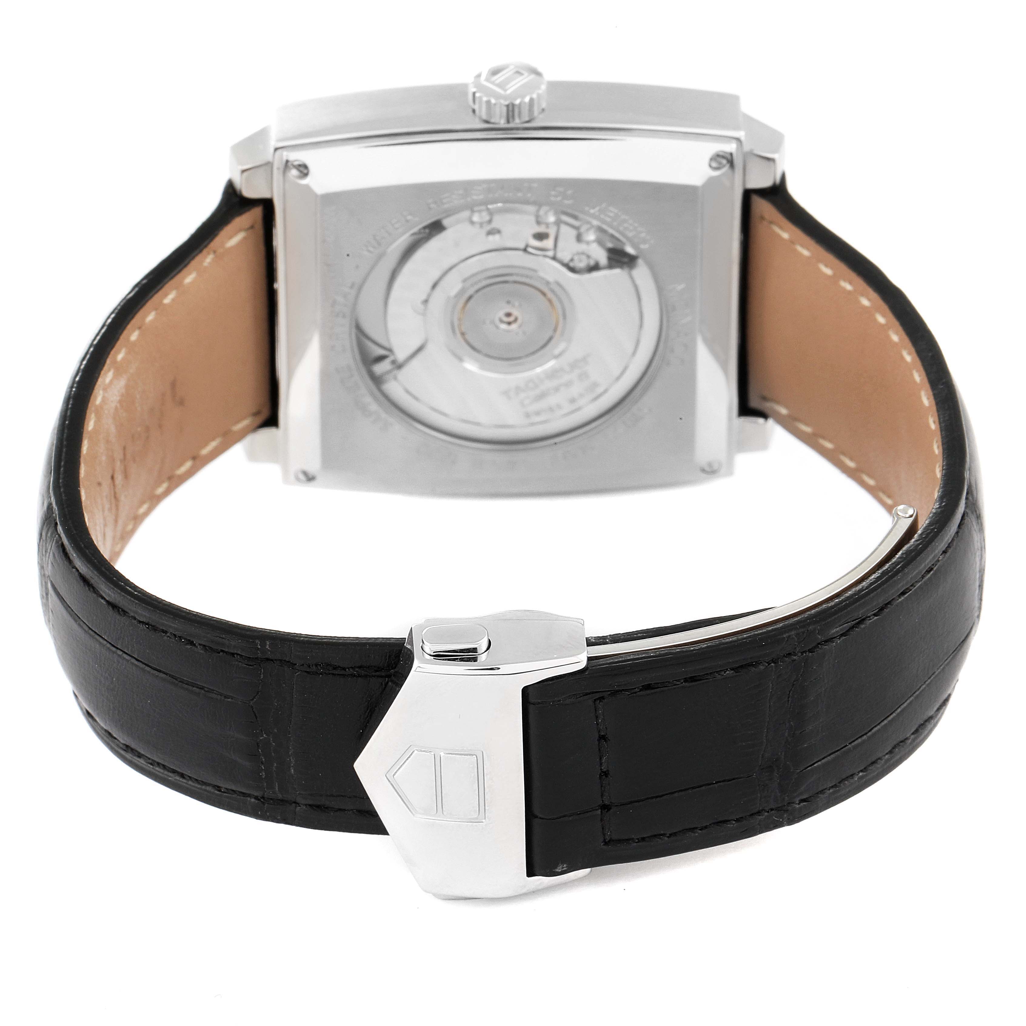 The image shows the back view of a Tag Heuer Monaco WW2110 Men's Stainless Steel Black Dial WW2110 Men's Stainless Steel Black Dial watch, highlighting its case back and leather strap with clasp.