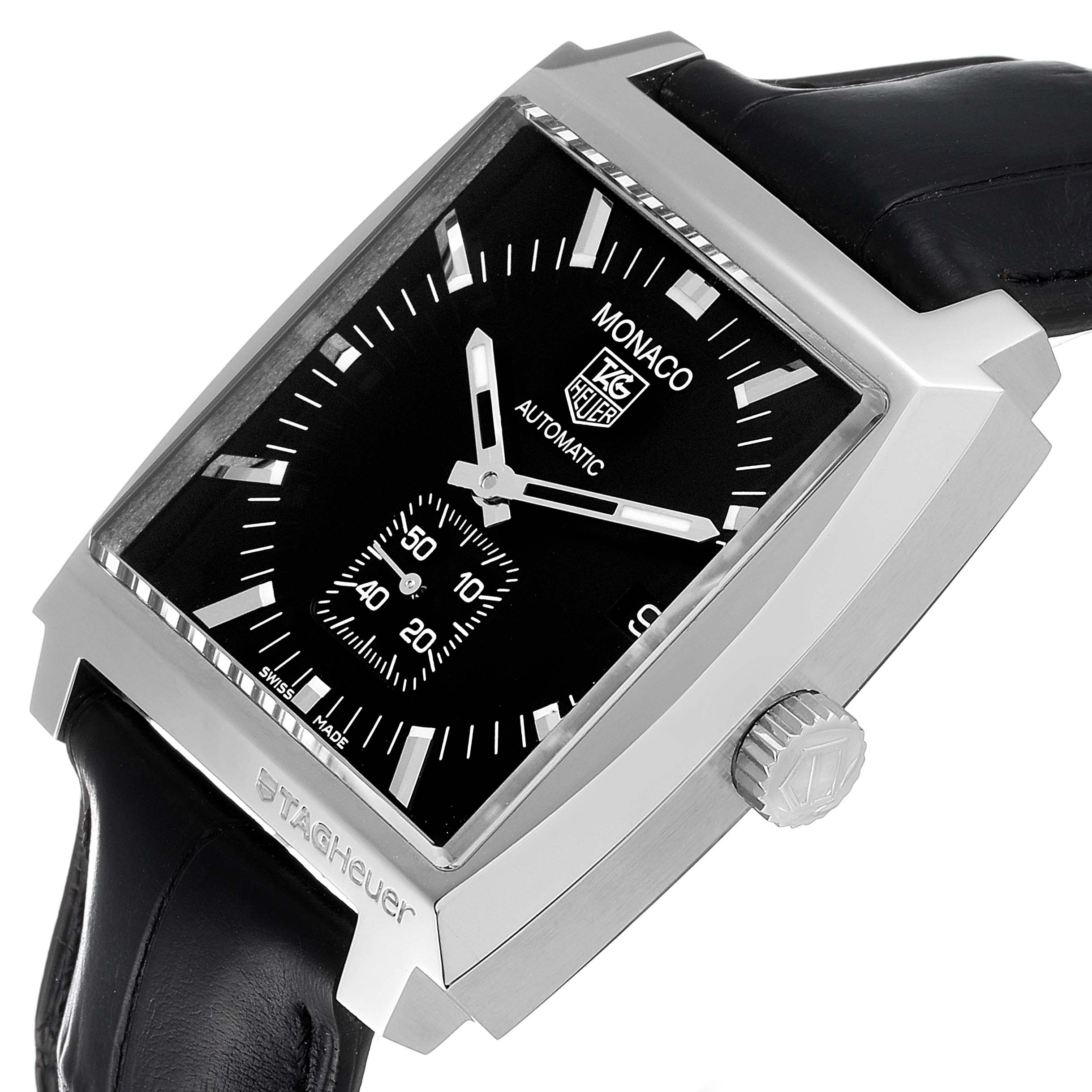 This image shows a tilted view of the Tag Heuer Monaco WW2110 Men's Stainless Steel Black Dial WW2110 Men's Stainless Steel Black Dial watch displaying its square face, side crown, and black leather strap.