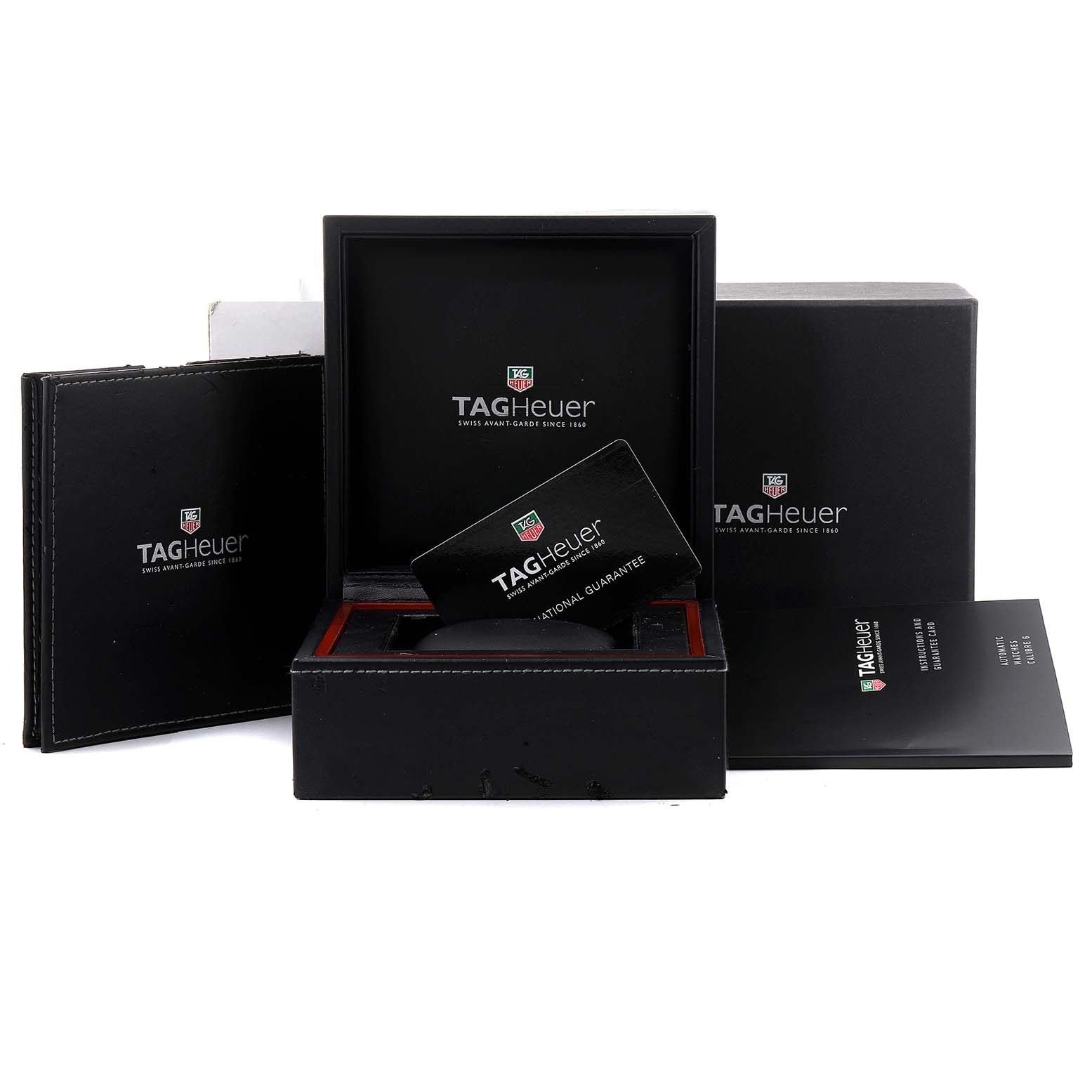 The image shows the packaging and accessories for a Tag Heuer Monaco WW2110 Men's Stainless Steel Black Dial WW2110 Men's Stainless Steel Black Dial watch, including the box, manual, and warranty card.