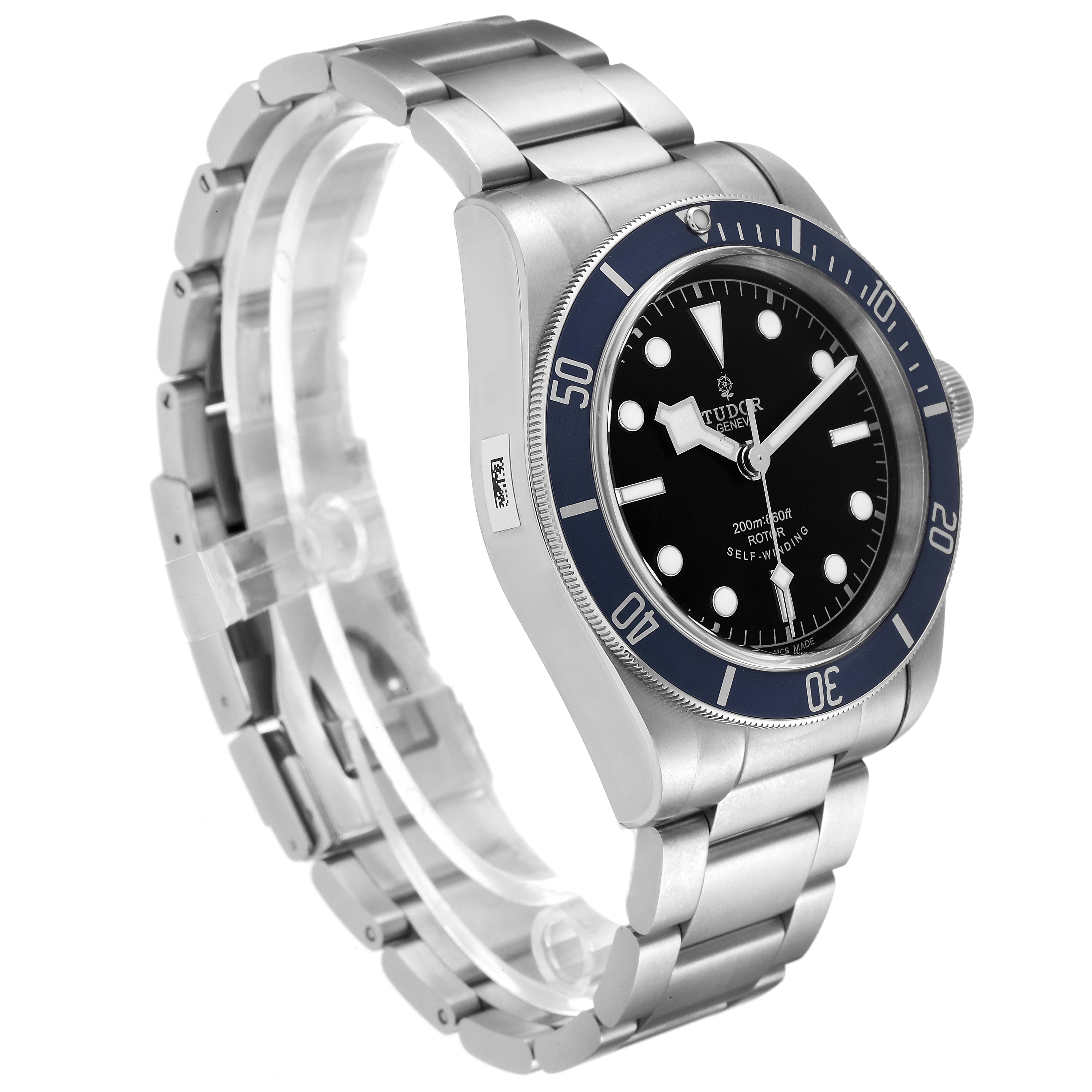 The image shows a Tudor Heritage Black Bay 79220 Men
s Stainless Steel Black Dial 79220 Men
s Stainless Steel Black Dial watch at a three-quarter angle, highlighting the face, bezel, and bracelet.