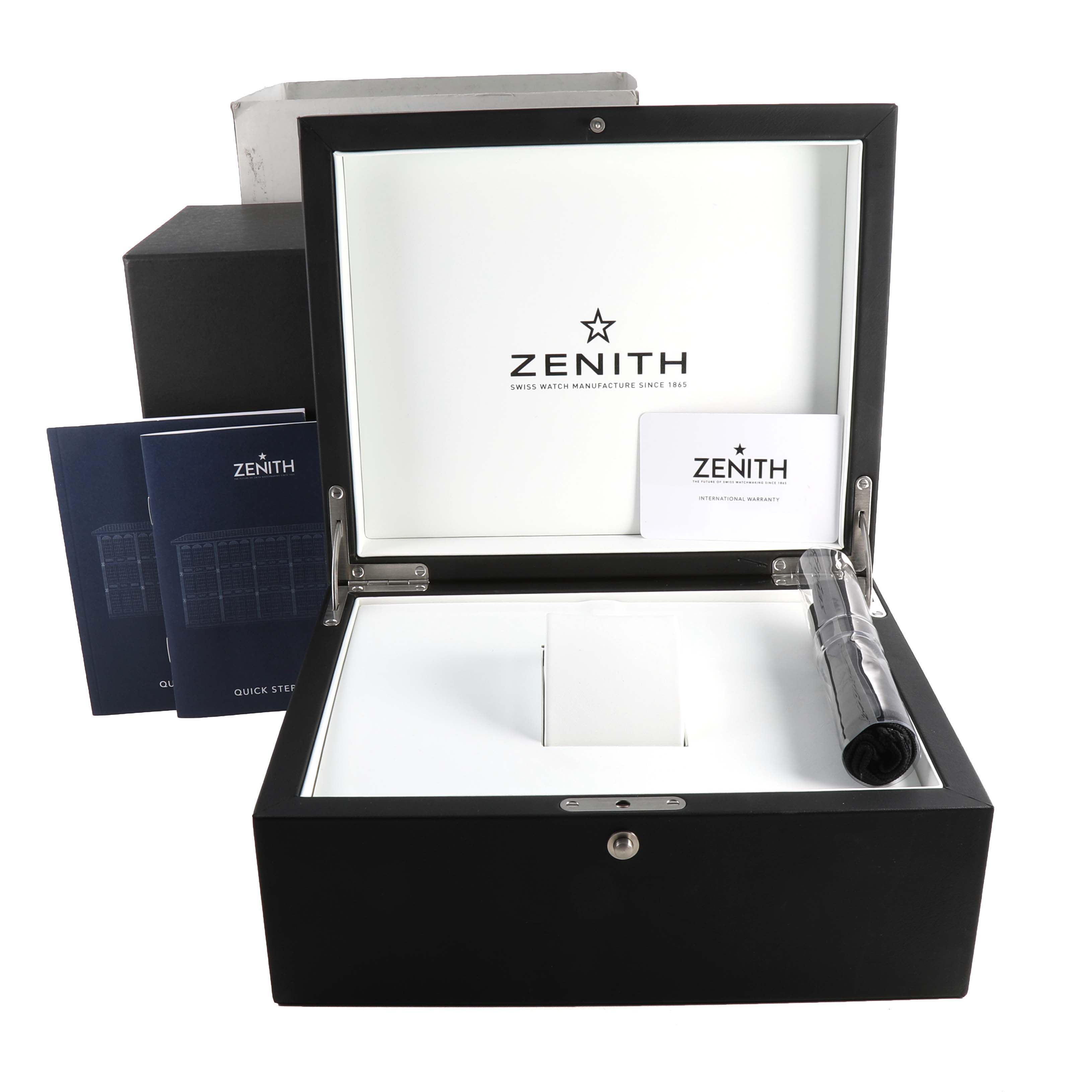 The image shows the packaging and documentation accessories for the Zenith Chronomaster 18.3100.3600/69.C920 Men's Rose Gold White Dial 18.3100.3600/69.C920 Men's Rose Gold White Dial watch, including the box, manuals, and warranty card.