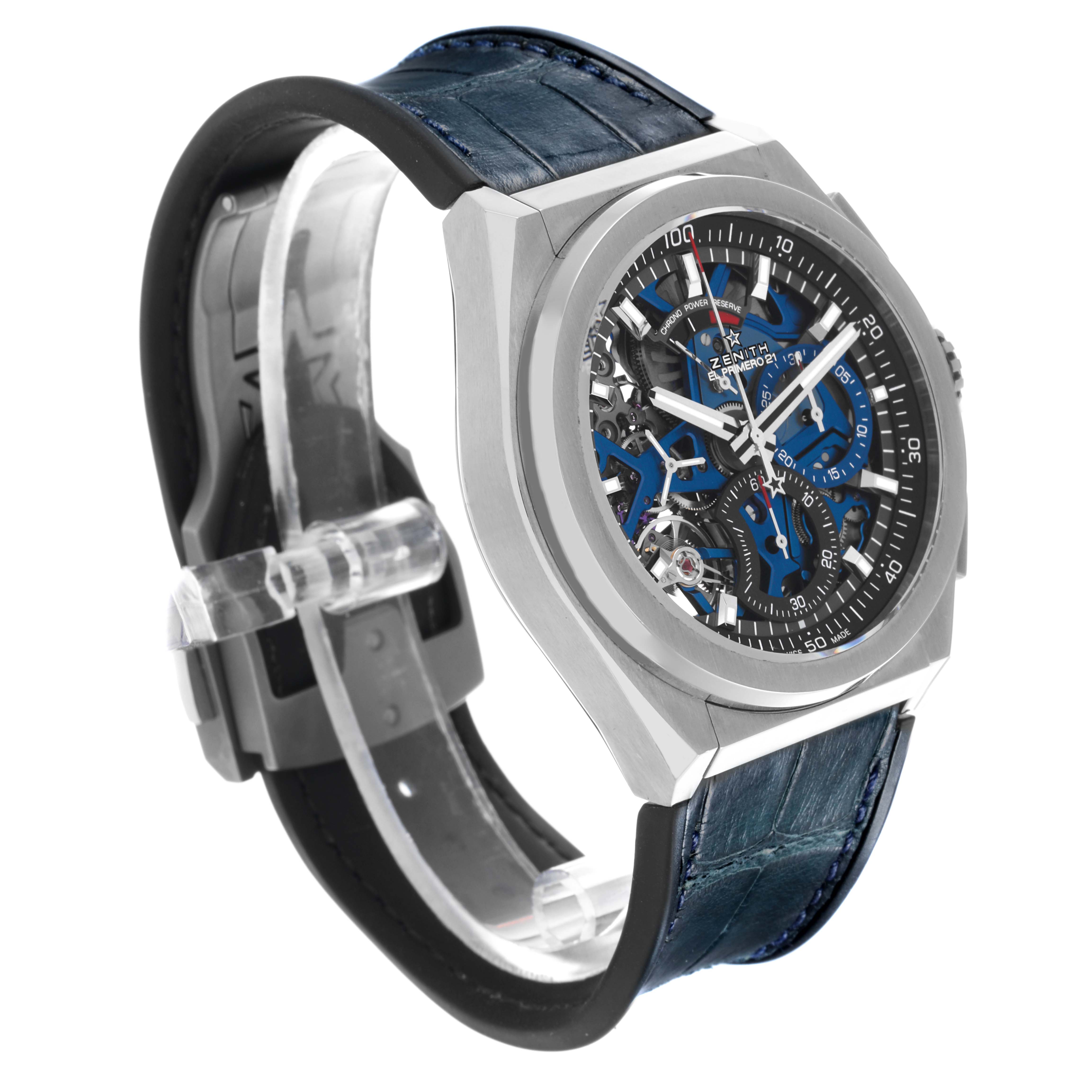 The Zenith El Primero 95.9002.9004/78.R584 Men
s Titanium Transparent Dial 95.9002.9004/78.R584 Men
s Titanium Transparent Dial watch is shown at an angle highlighting the skeleton dial, bezel, and blue strap.