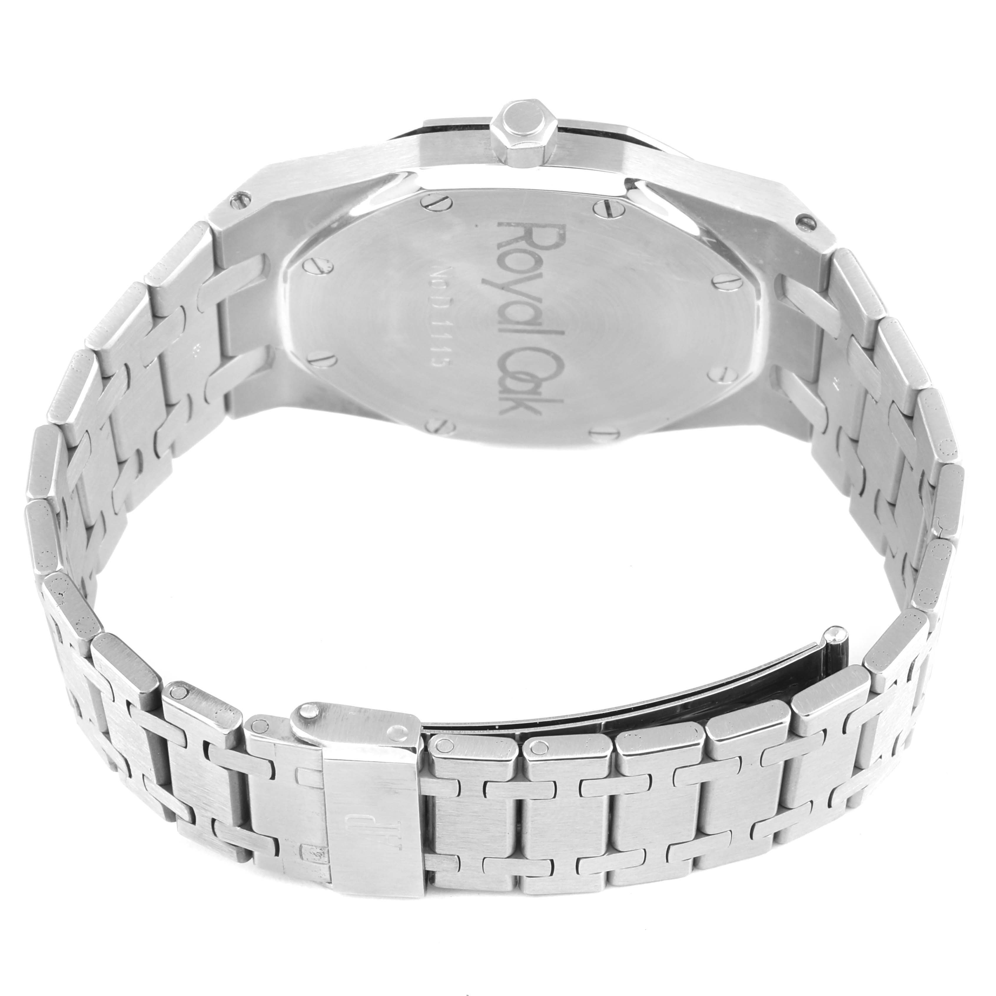 The image shows the back and bracelet of a Royal Oak by Audemars Piguet, focusing on the case back, crown, and clasp.