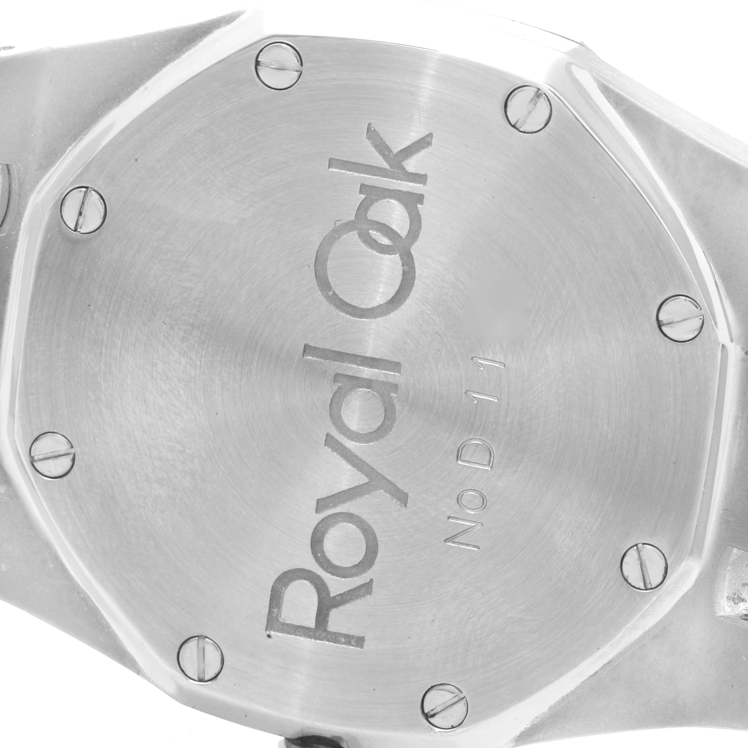 The image shows the back cover of an Audemars Piguet Royal Oak 5402ST Men's Stainless Steel Black Dial 5402ST Men's Stainless Steel Black Dial watch, featuring its branding and screws.