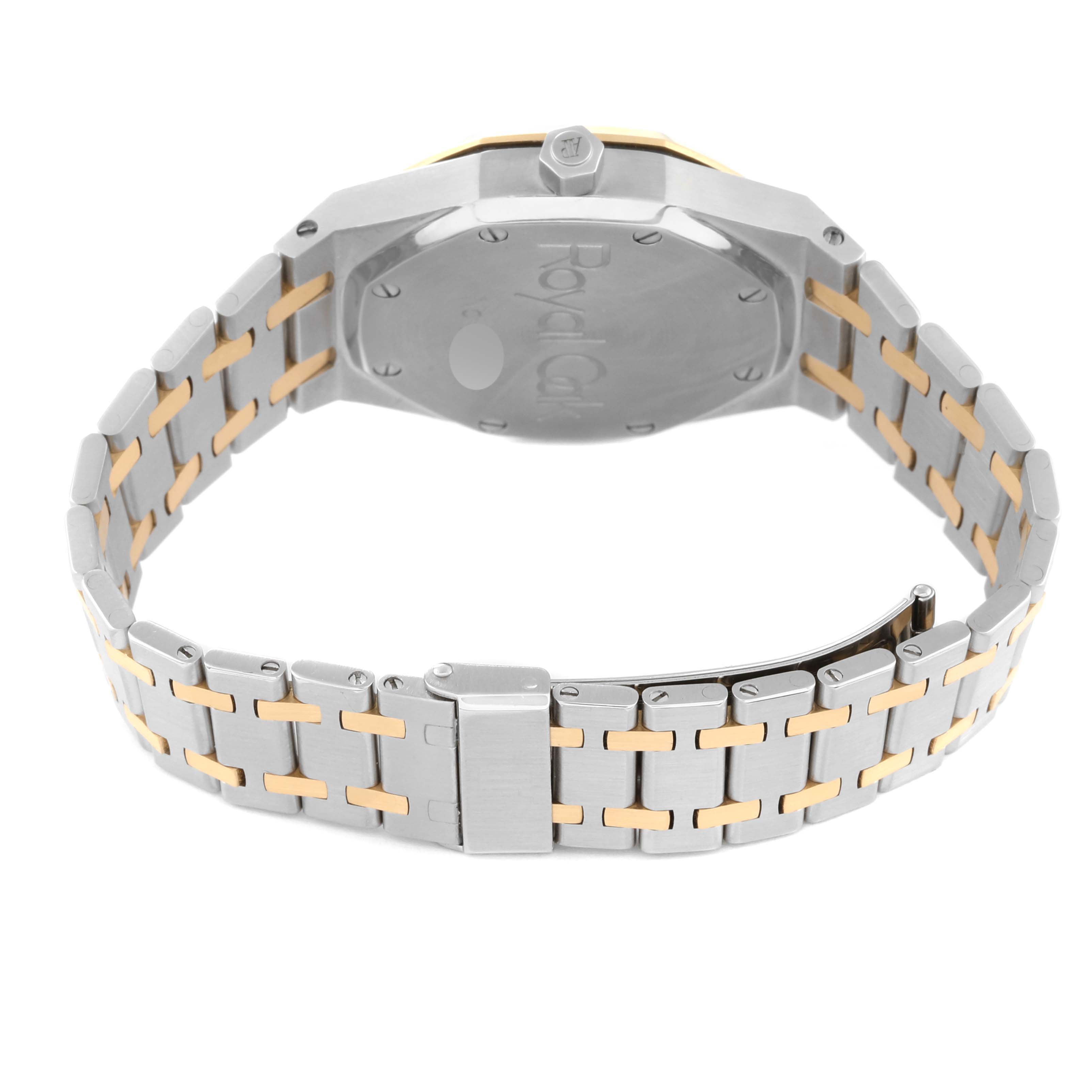 The image shows the backside and bracelet of the Audemars Piguet Royal Oak 25594SA Men's Steel and Gold (two tone) Silver Dial 25594SA Men's Steel and Gold (two tone) Silver Dial watch from a rear angle.