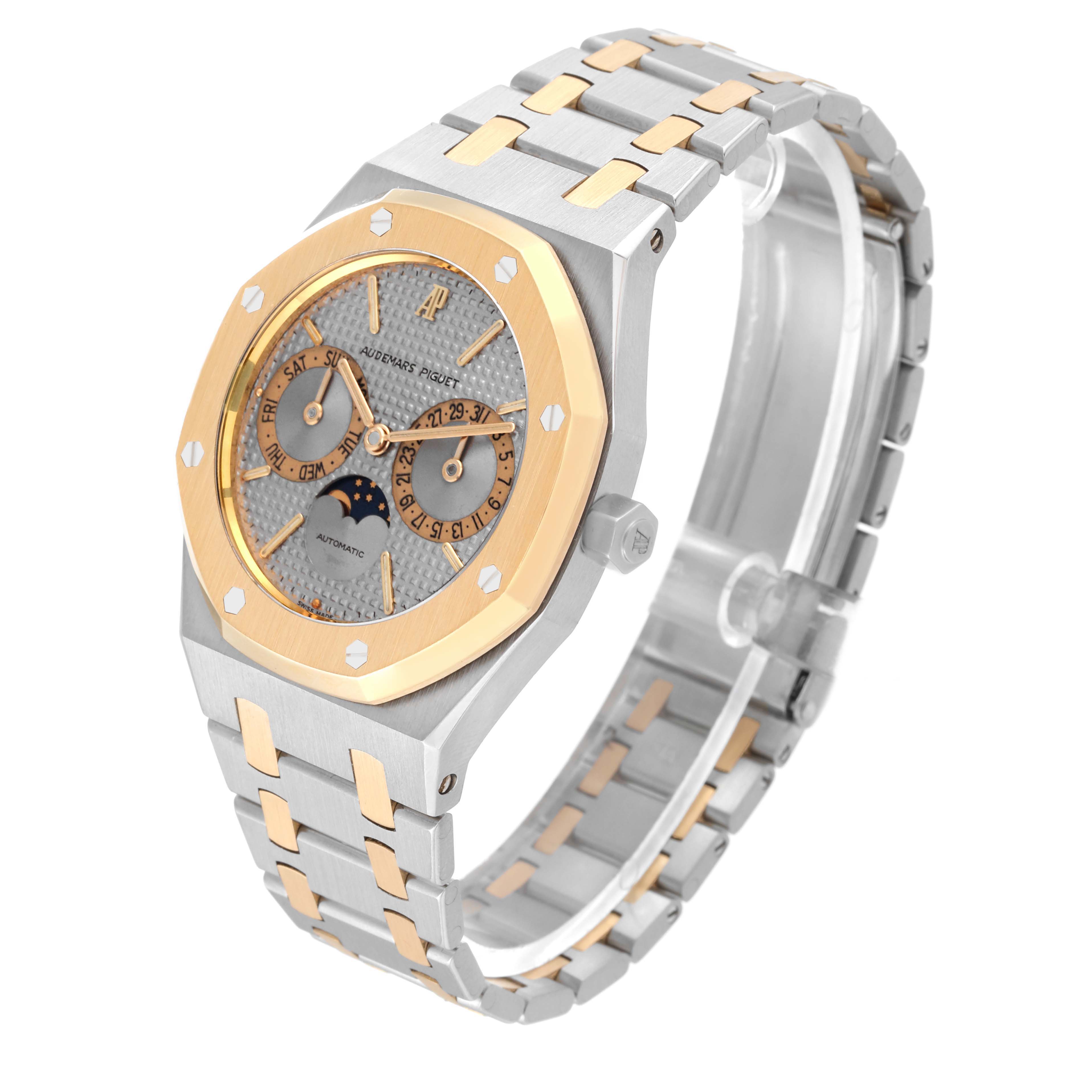 The image shows an angled view of the Audemars Piguet Royal Oak 25594SA Men's Steel and Gold (two tone) Silver Dial 25594SA Men's Steel and Gold (two tone) Silver Dial watch, focusing on the face, bezel, and part of the bracelet.