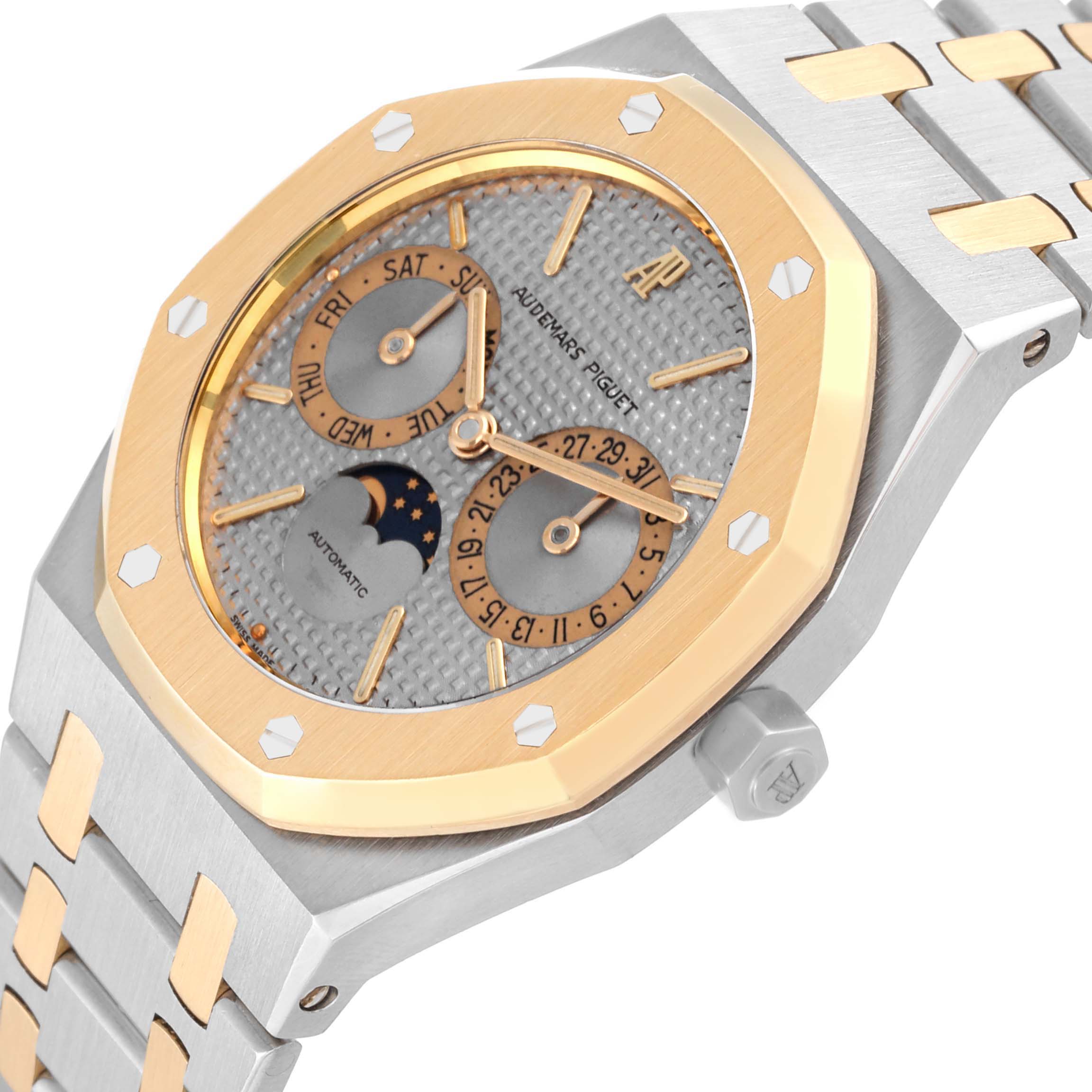 This image shows a close-up angle of the Audemars Piguet Royal Oak 25594SA Men's Steel and Gold (two tone) Silver Dial 25594SA Men's Steel and Gold (two tone) Silver Dial watch, highlighting its face, bezel, and part of the bracelet.