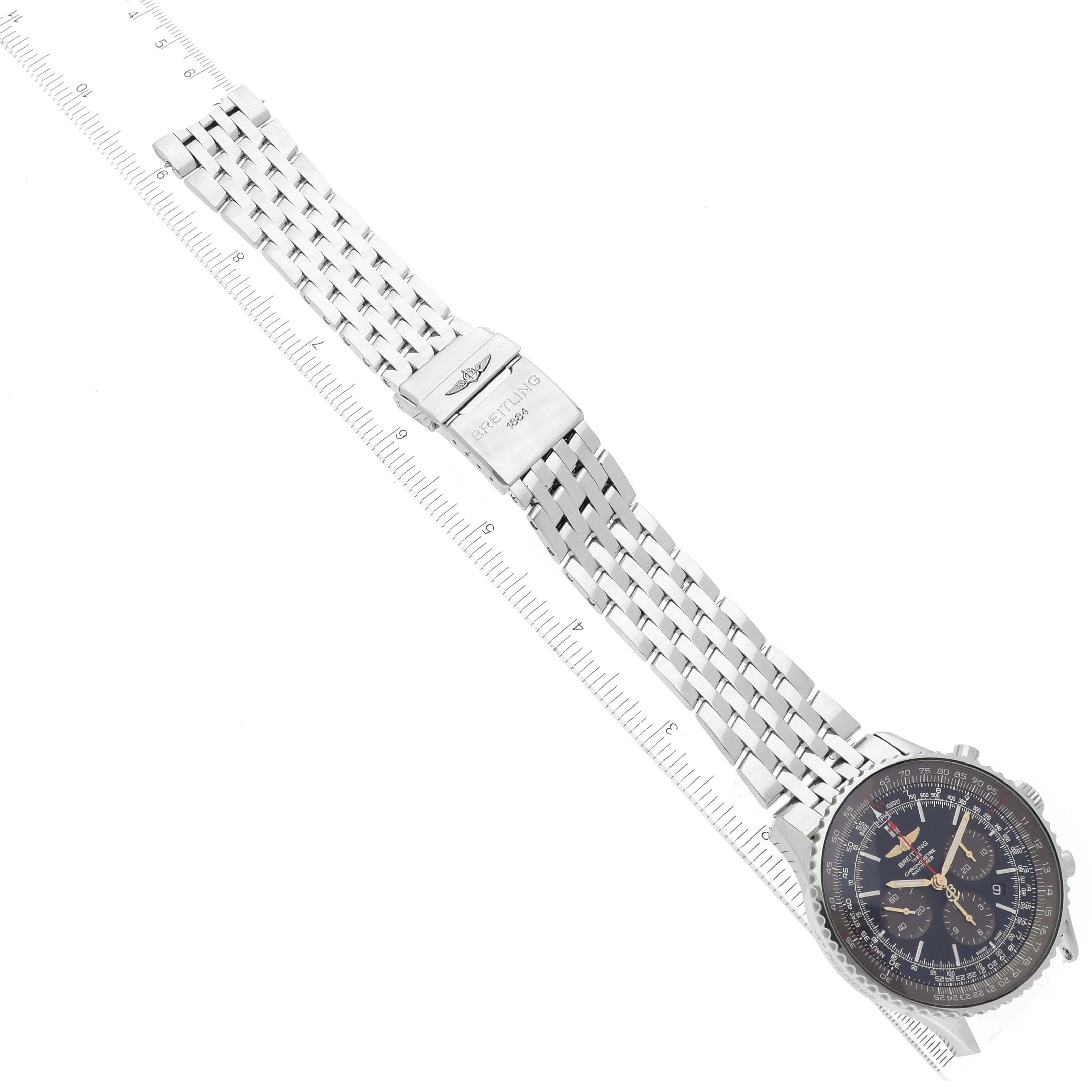The image shows an overhead view of the Breitling Limited Series watch featuring its dial, bezel, and metal bracelet with clasp.