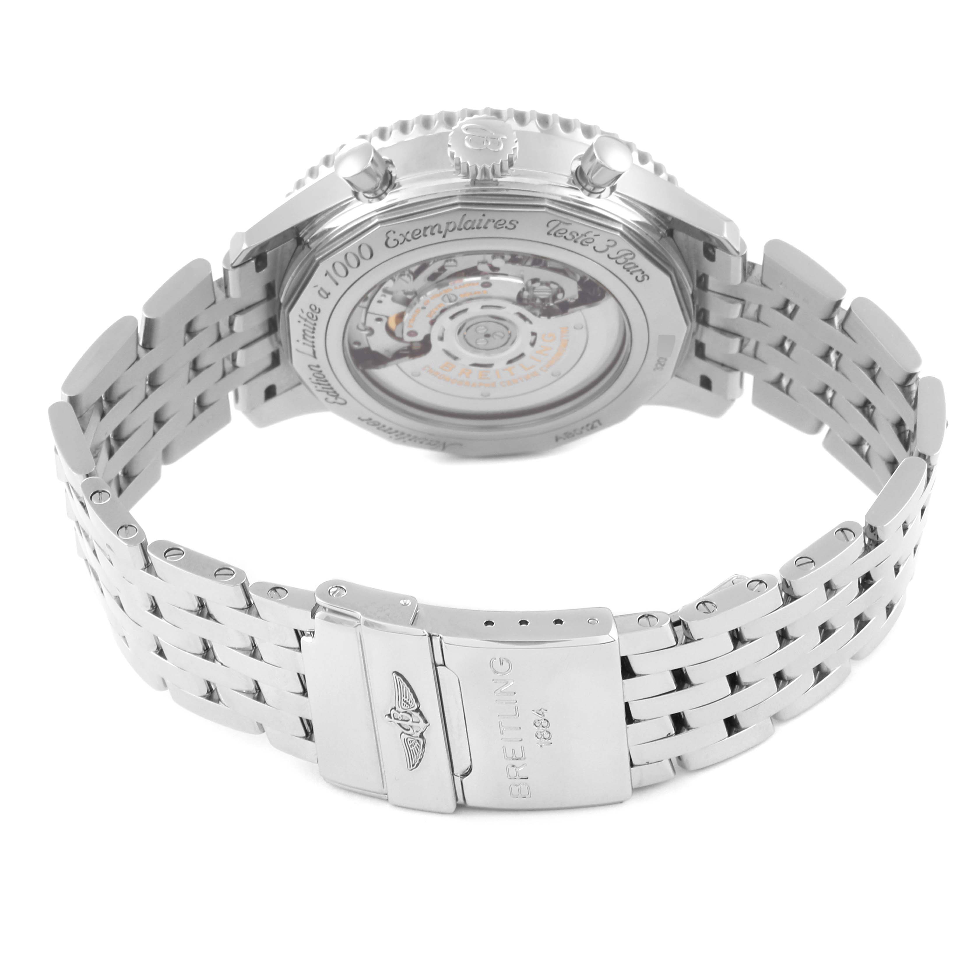 The image shows the back and bracelet clasp of a Breitling Limited Series watch, highlighting its intricate movement and metal strap.