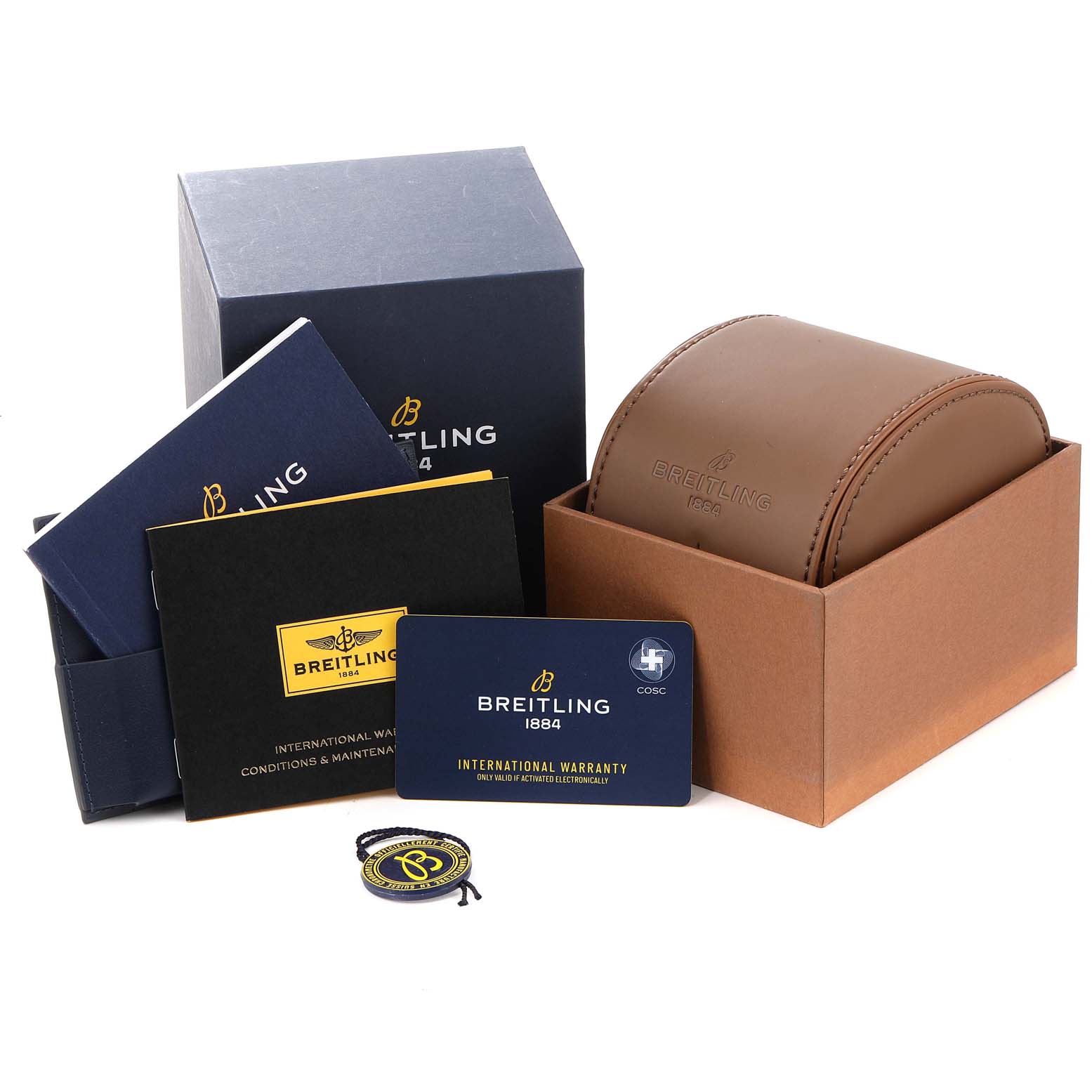 The image shows the packaging and accessories for the Breitling Superocean A17366 Men's Stainless Steel White Dial A17366 Men's Stainless Steel White Dial watch, which includes a box, manuals, a warranty card, and a watch case.