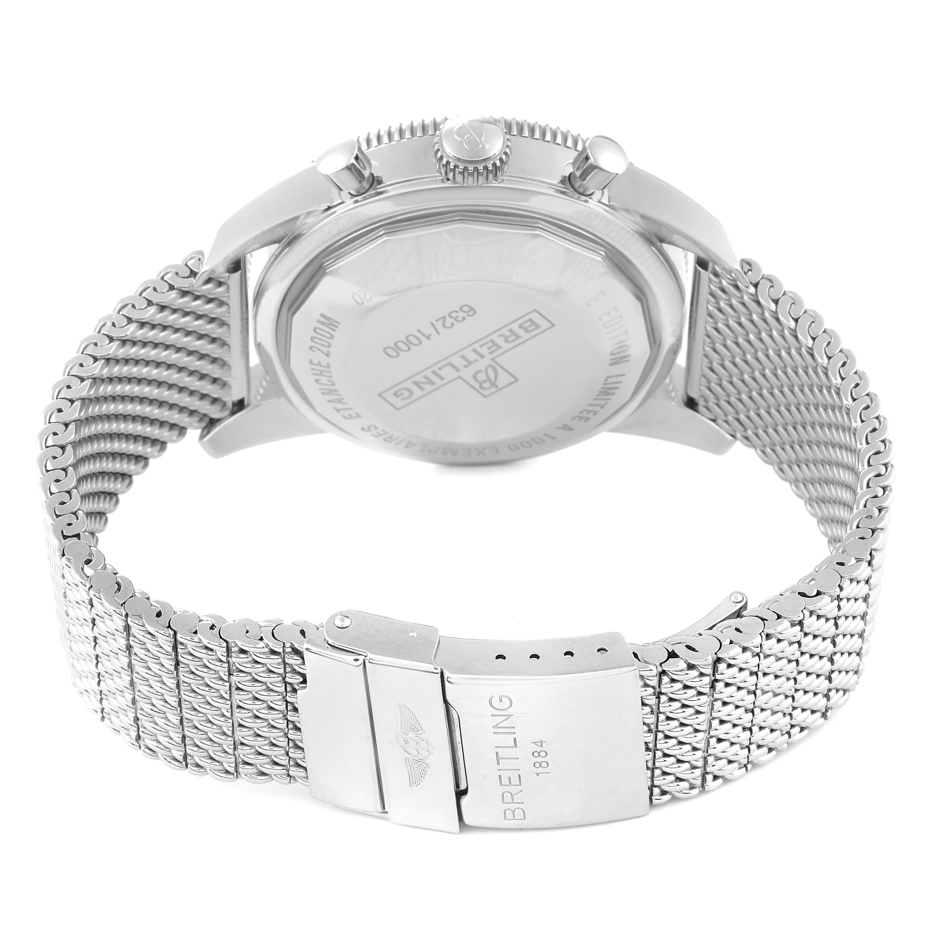 The image shows the back view of a Breitling Limited Series watch, including the case, crown, and metal mesh bracelet clasp.