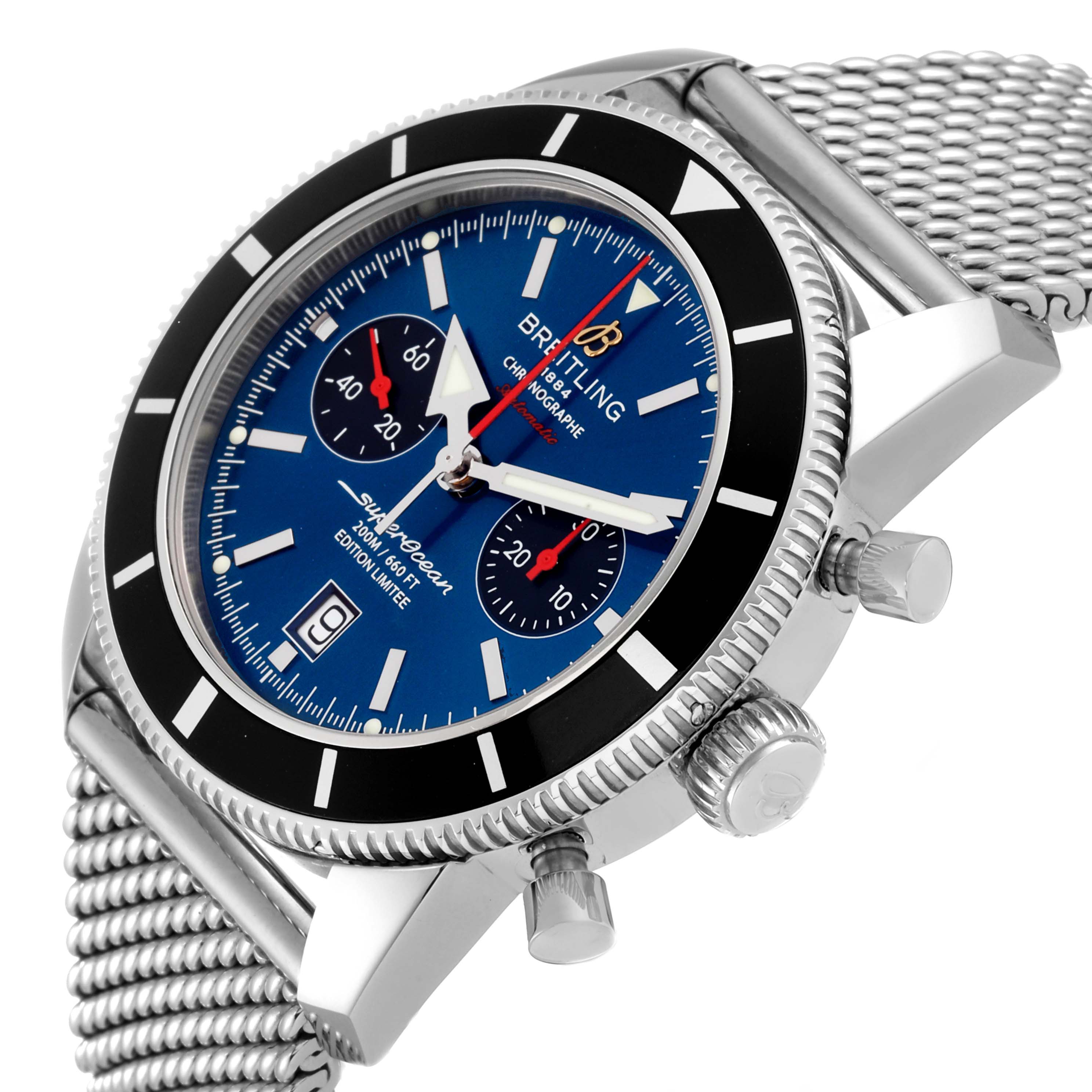 The image shows a side-angle view of the Breitling Superocean A23320 Men's Stainless Steel Blue Dial A23320 Men's Stainless Steel Blue Dial Heritage Limited Edition watch, showcasing its face, crown, and mesh bracelet.