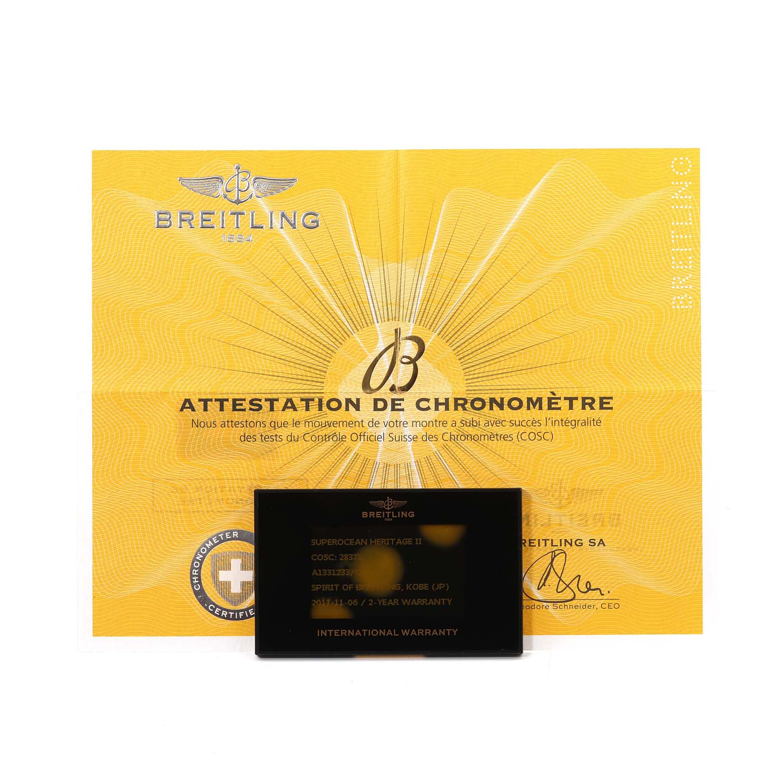 The image shows a Breitling Superocean A13312 Men's Stainless Steel Brown Dial A13312 Men's Stainless Steel Brown Dial certificate and an international warranty card.