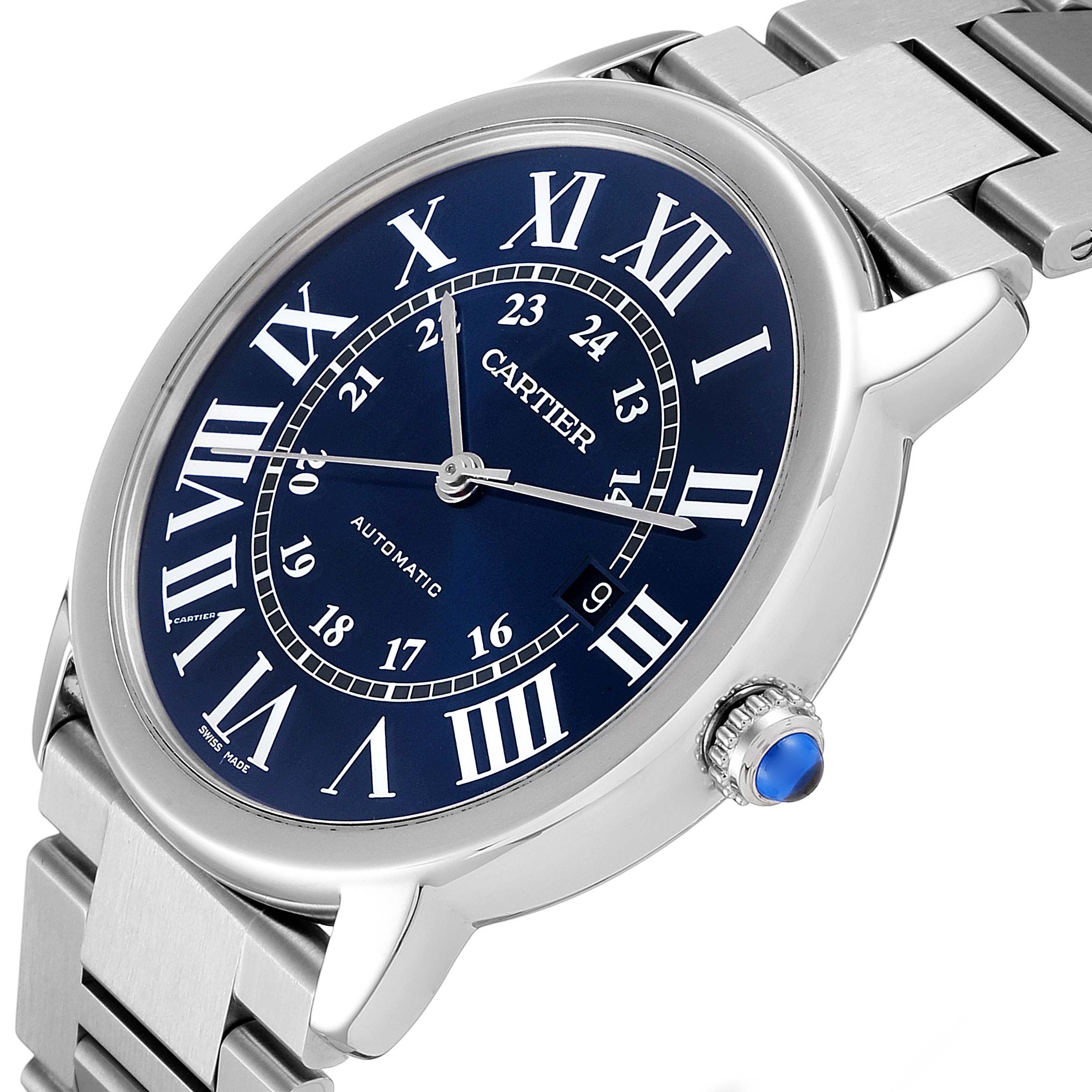 The image shows a Cartier Ronde WSRN0023 Men's Stainless Steel Blue Dial WSRN0023 Men's Stainless Steel Blue Dial watch from a slight side angle, displaying its blue dial, Roman numerals, metal bracelet, and crown set with a blue cabochon.
