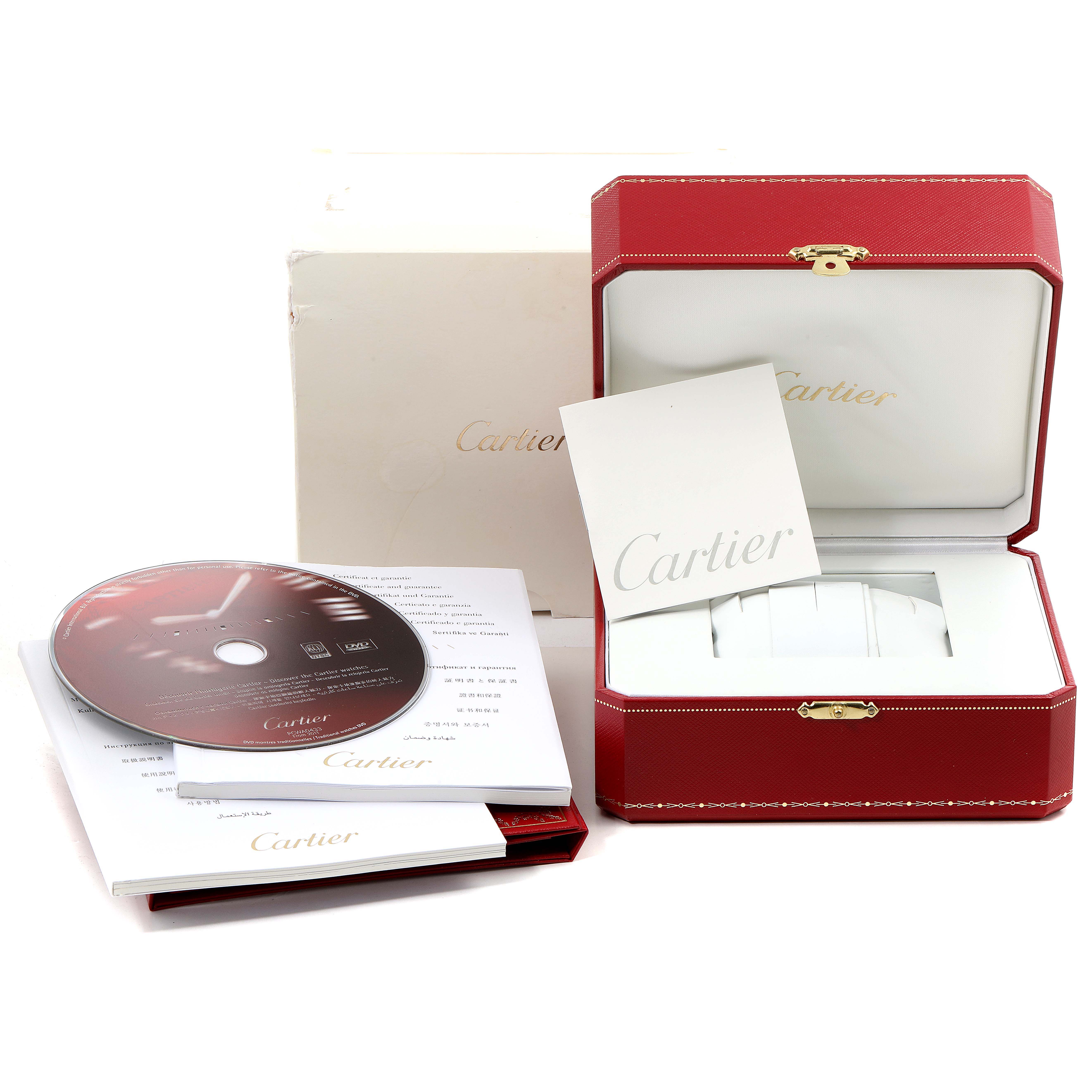 This image shows the packaging and accessories for the Cartier Ronde W6701009 Men's Rose Gold Silver Dial W6701009 Men's Rose Gold Silver Dial model, including the box, manuals, and a CD.