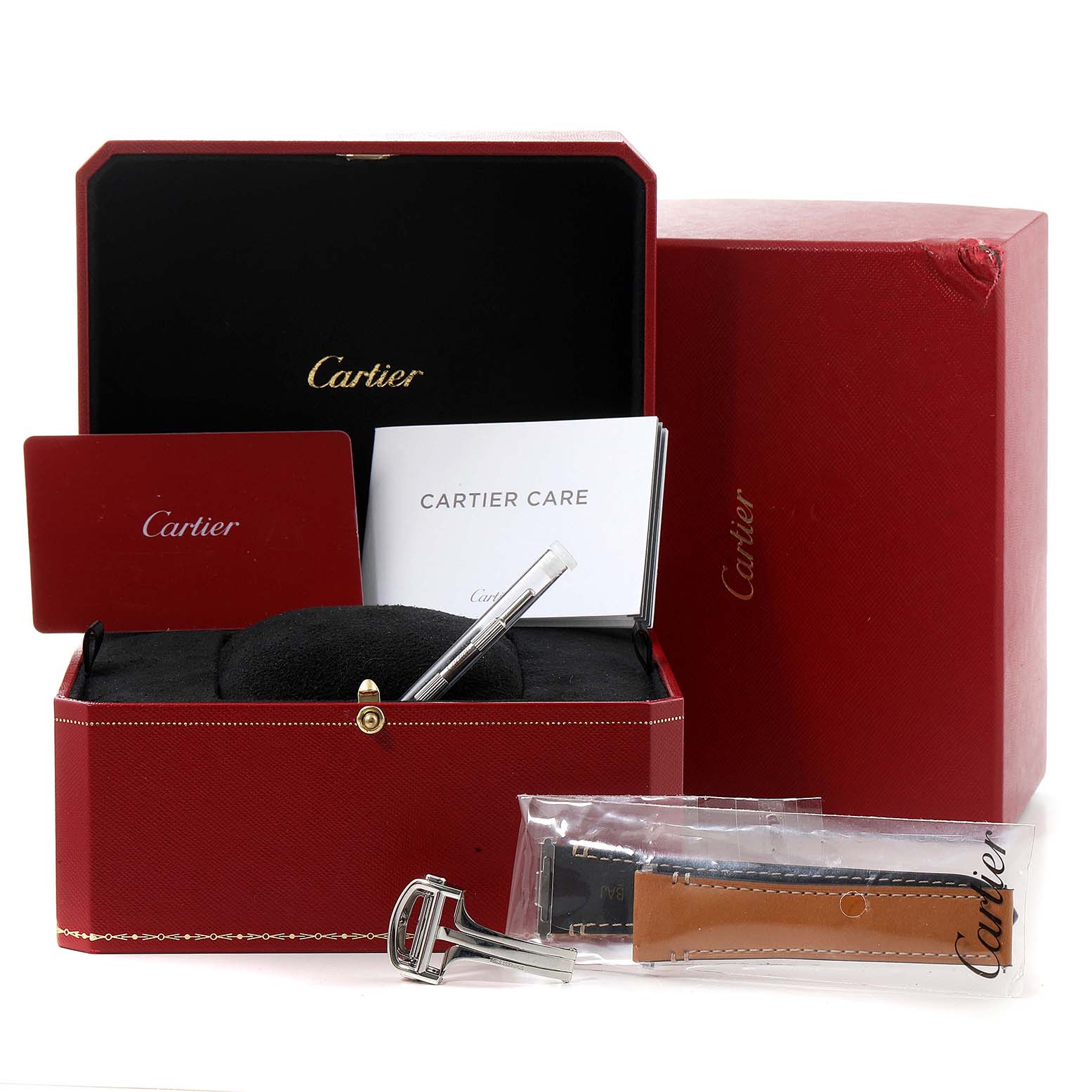 The image shows the packaging, care booklet, an extra strap, and a clasp for the Cartier Santos WSSA0018 Men's Stainless Steel Silver Dial WSSA0018 Men's Stainless Steel Silver Dial model watch.