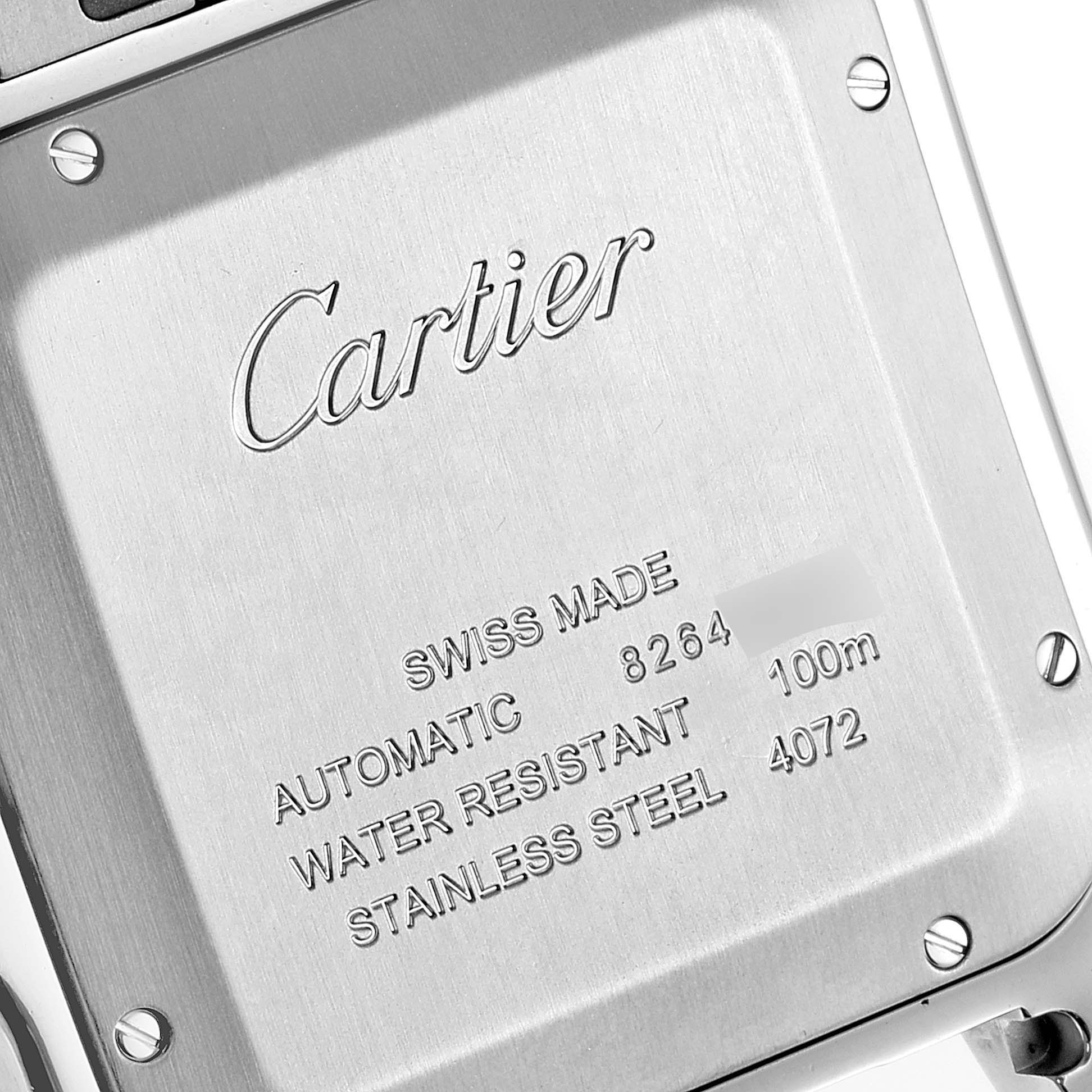 The image shows the back case of a Santos model watch by Cartier, displaying engraved details and screws.