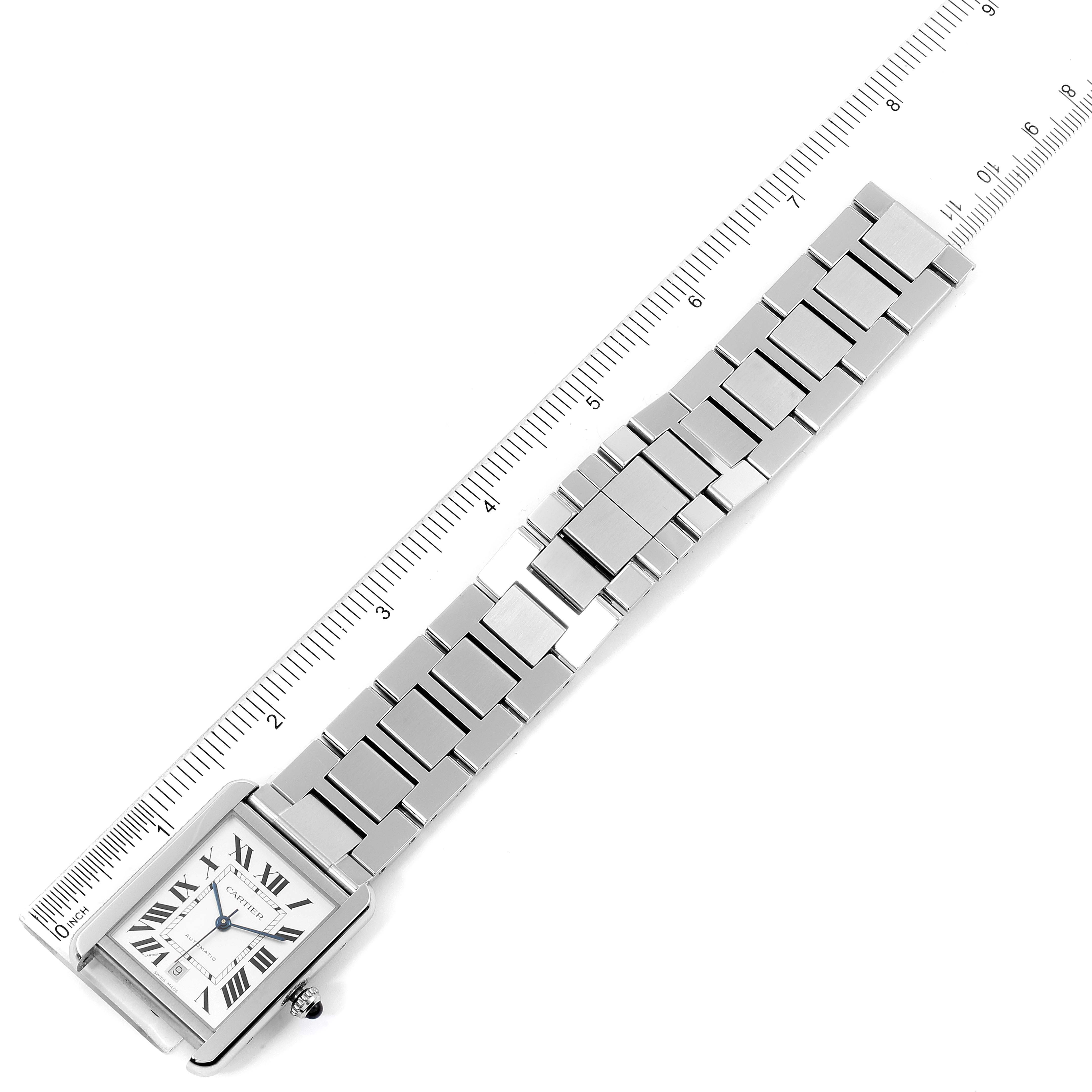 The image shows the Cartier Tank Solo W5200028 Men's Stainless Steel Silver Dial W5200028 Men's Stainless Steel Silver Dial watch laid flat, with its face and bracelet visible alongside a measurement ruler.