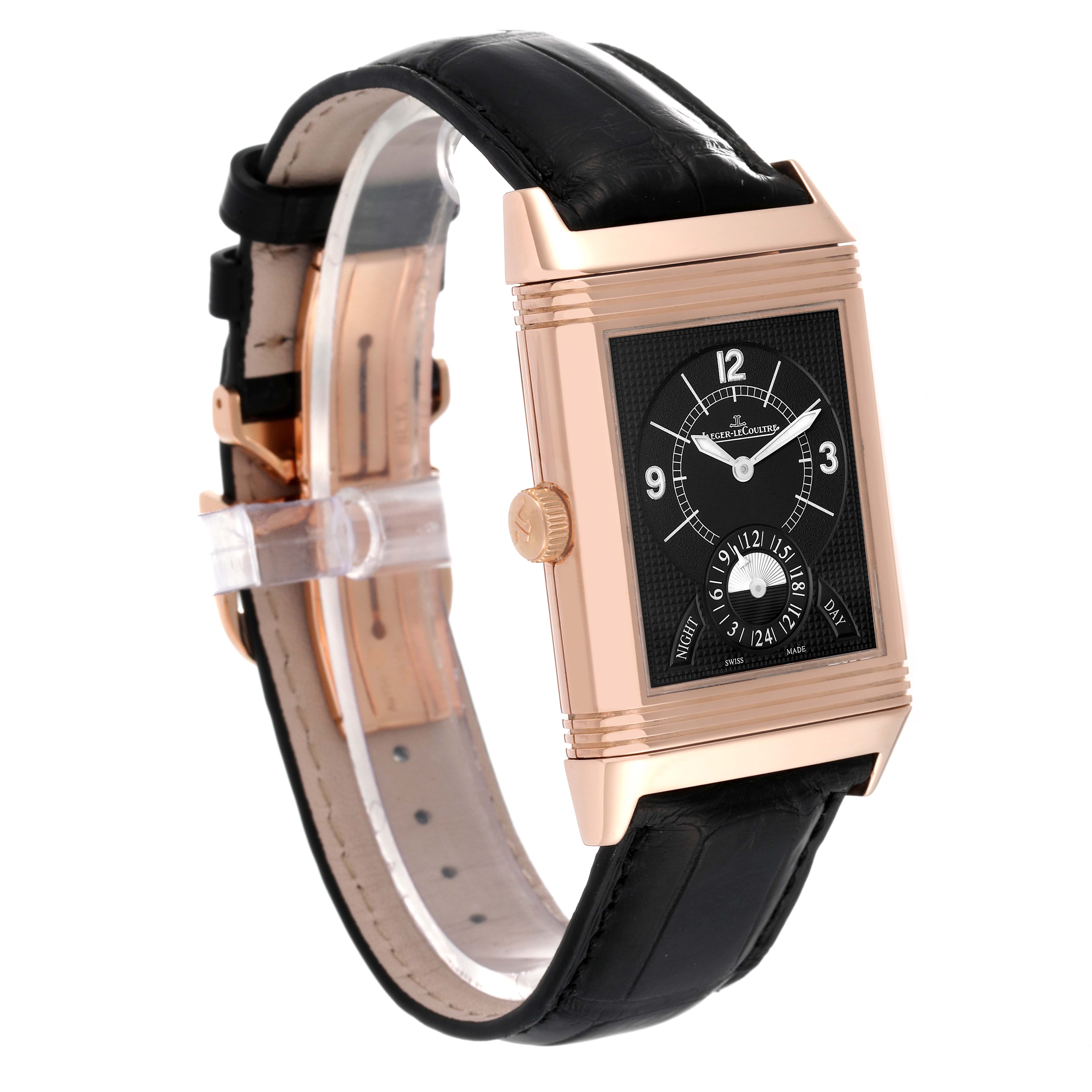 The Jaeger-LeCoultre Reverso watch is shown at an angled side view, highlighting its rectangular face and leather strap.