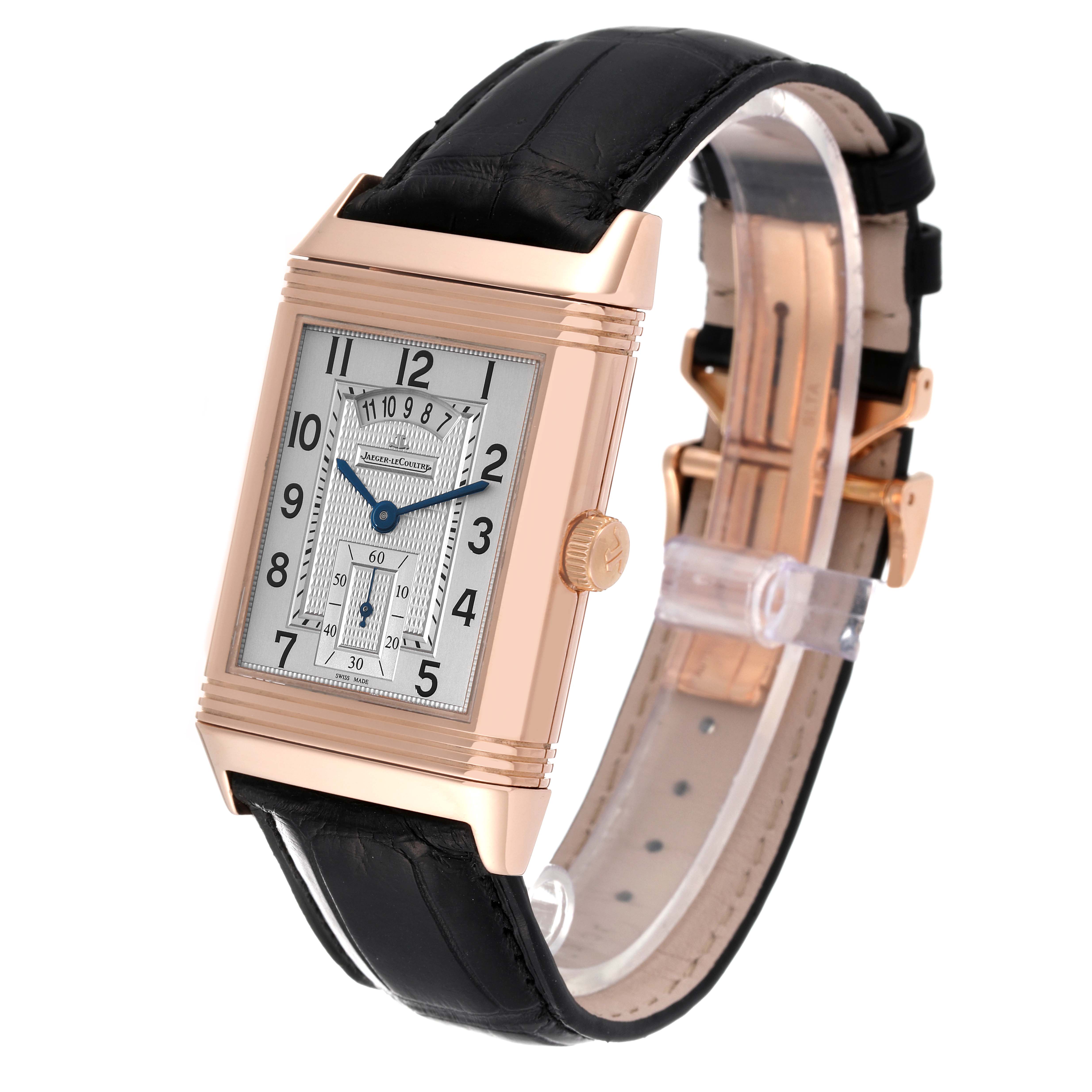 The image shows a Jaeger-LeCoultre Reverso watch at a slight angle, highlighting its dial, case, leather strap, and clasp.