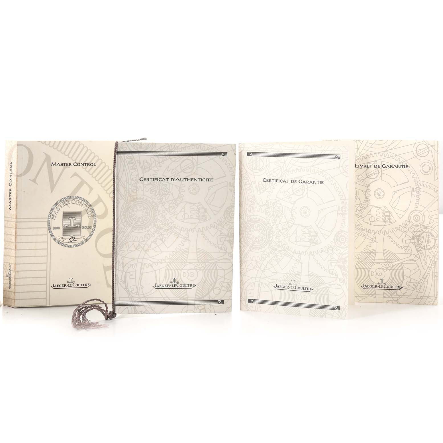 The image shows the packaging, authenticity certificate, and warranty booklet for the Jaeger-LeCoultre Master model watch.