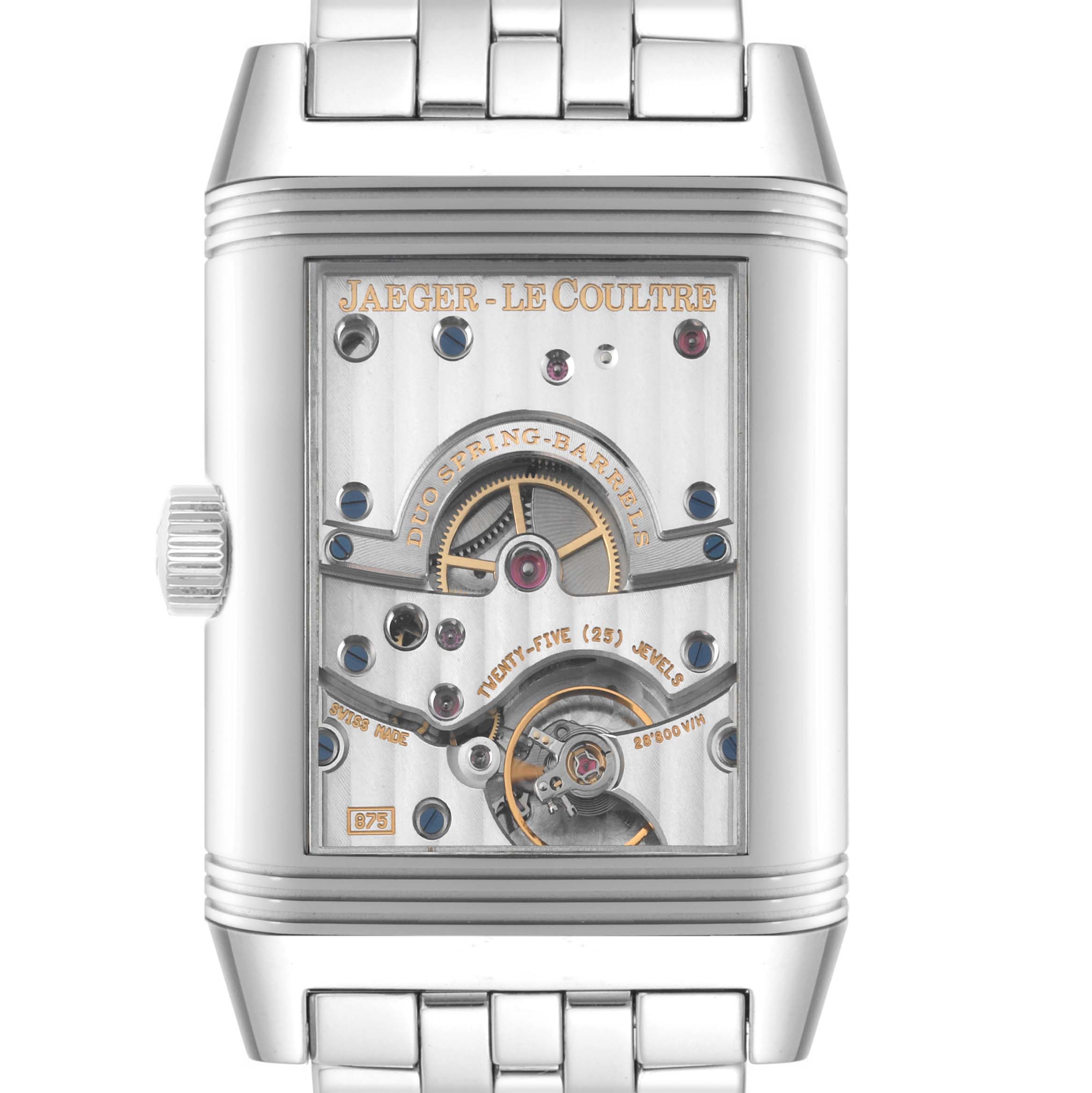 The image shows the back view of a Jaeger-LeCoultre Reverso watch, displaying its mechanical movement and intricate details.