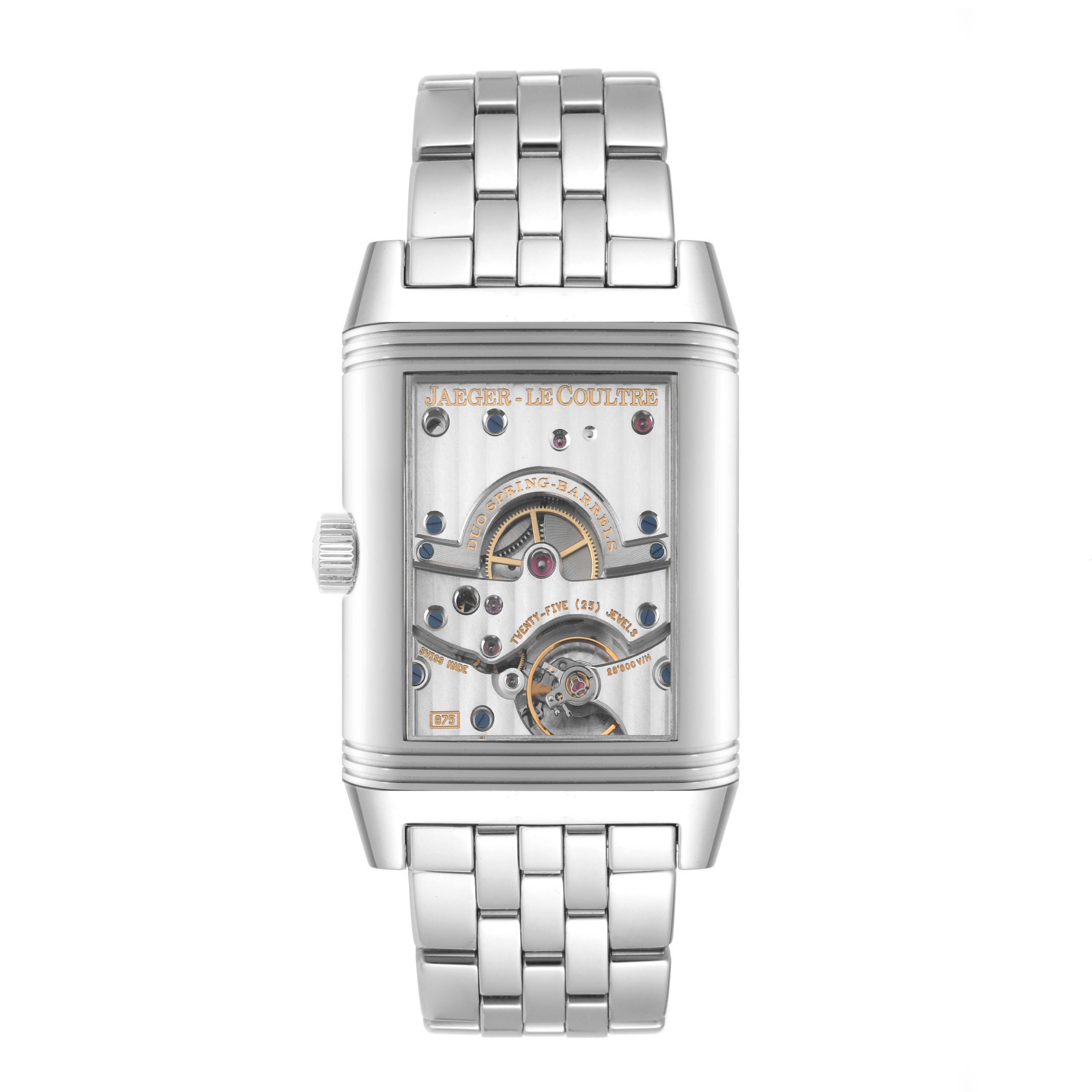 The Jaeger-LeCoultre Reverso watch is shown from the front, featuring its exposed mechanical movement and stainless steel bracelet.