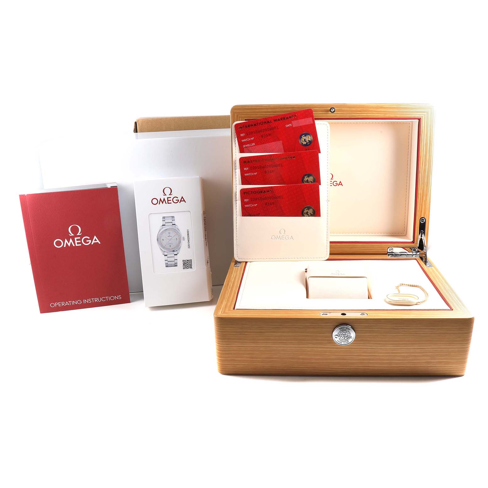 The image shows the Omega Seamaster 220.10.40.20.06.001 Men
s Stainless Steel Grey Dial 220.10.40.20.06.001 Men
s Stainless Steel Grey Dial watch packaging, including an open wooden box with cards, user manuals, and operating instructions.