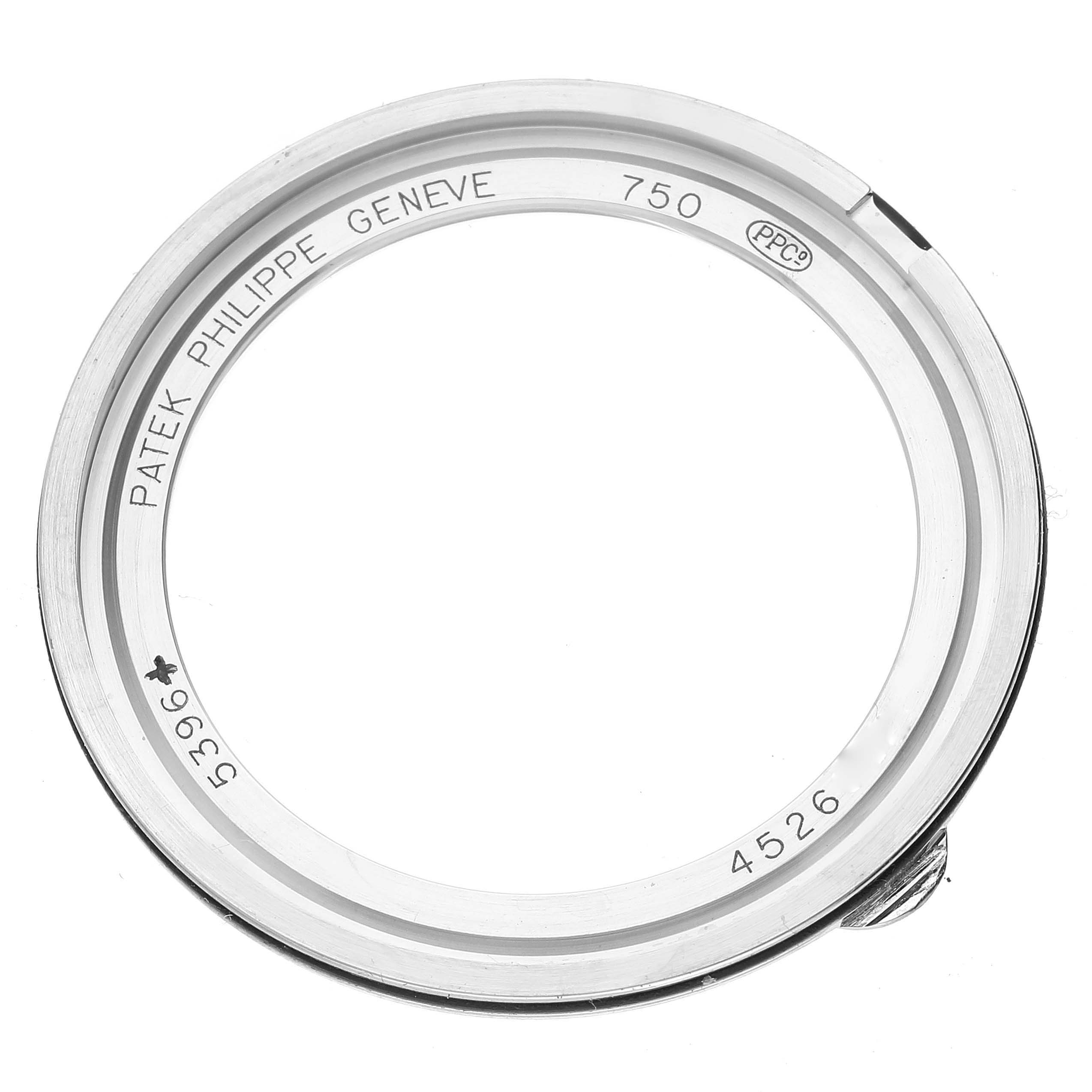 This image shows a top-down view of the case bezel for a Patek Philippe Complications 5396G - 011 Men
s White Gold Silver Dial 5396G - 011 Men
s White Gold Silver Dial model, revealing the engravings and markings.