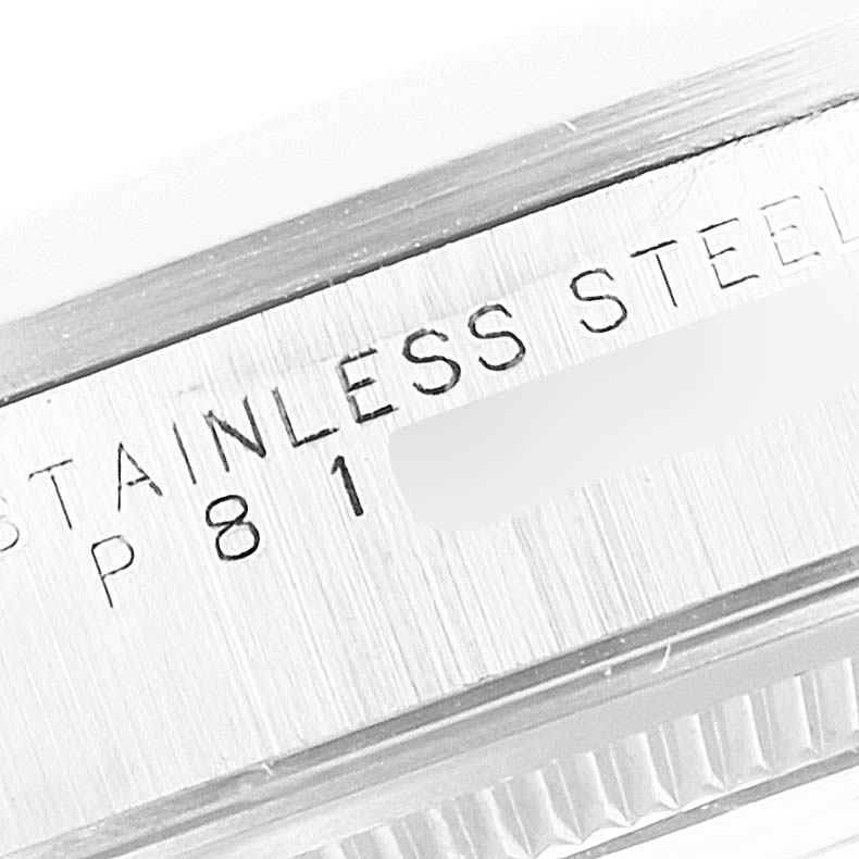 This close-up image shows the side of the stainless steel casing of a Rolex Air-King 14000 Men's Stainless Steel Silver Dial 14000 Men's Stainless Steel Silver Dial watch, engraved with partial text.