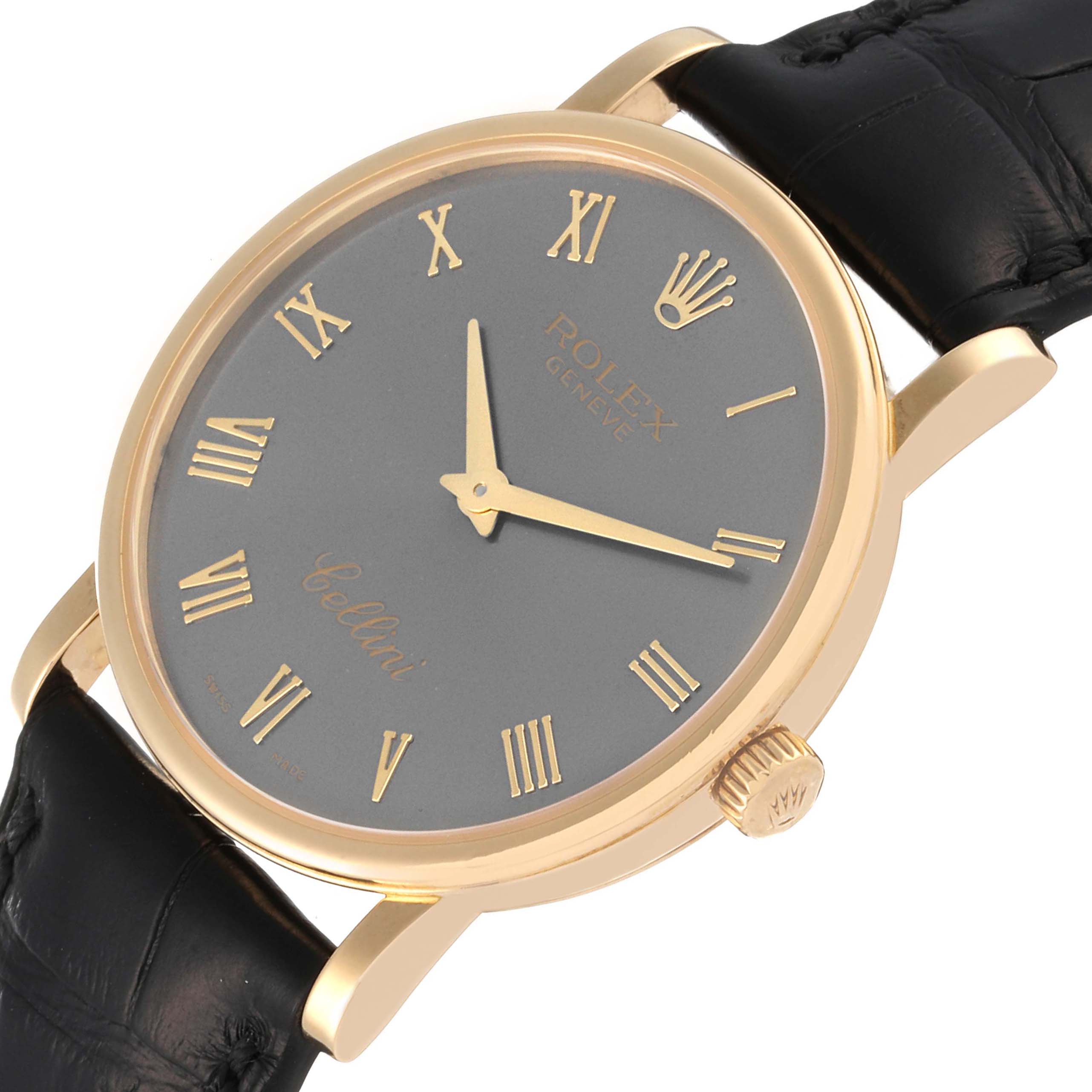 The image shows a close-up angle of the Rolex Cellini 5115 Men's Yellow Gold Grey Dial 5115 Men's Yellow Gold Grey Dial watch's face, crown, and part of its leather strap.