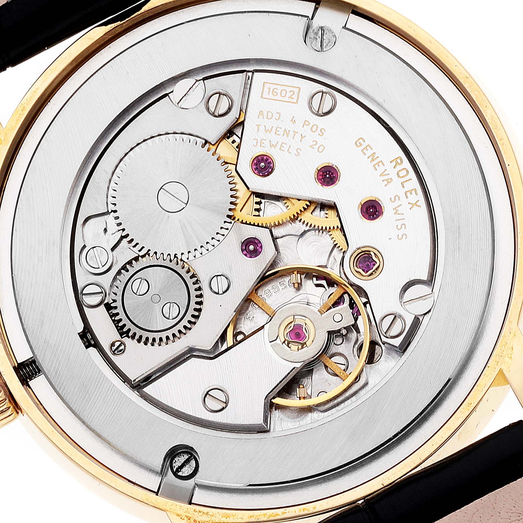 This is a close-up of the movement of a Rolex Cellini 5115 Men's Yellow Gold Grey Dial 5115 Men's Yellow Gold Grey Dial watch, showcasing its intricate gears and components.