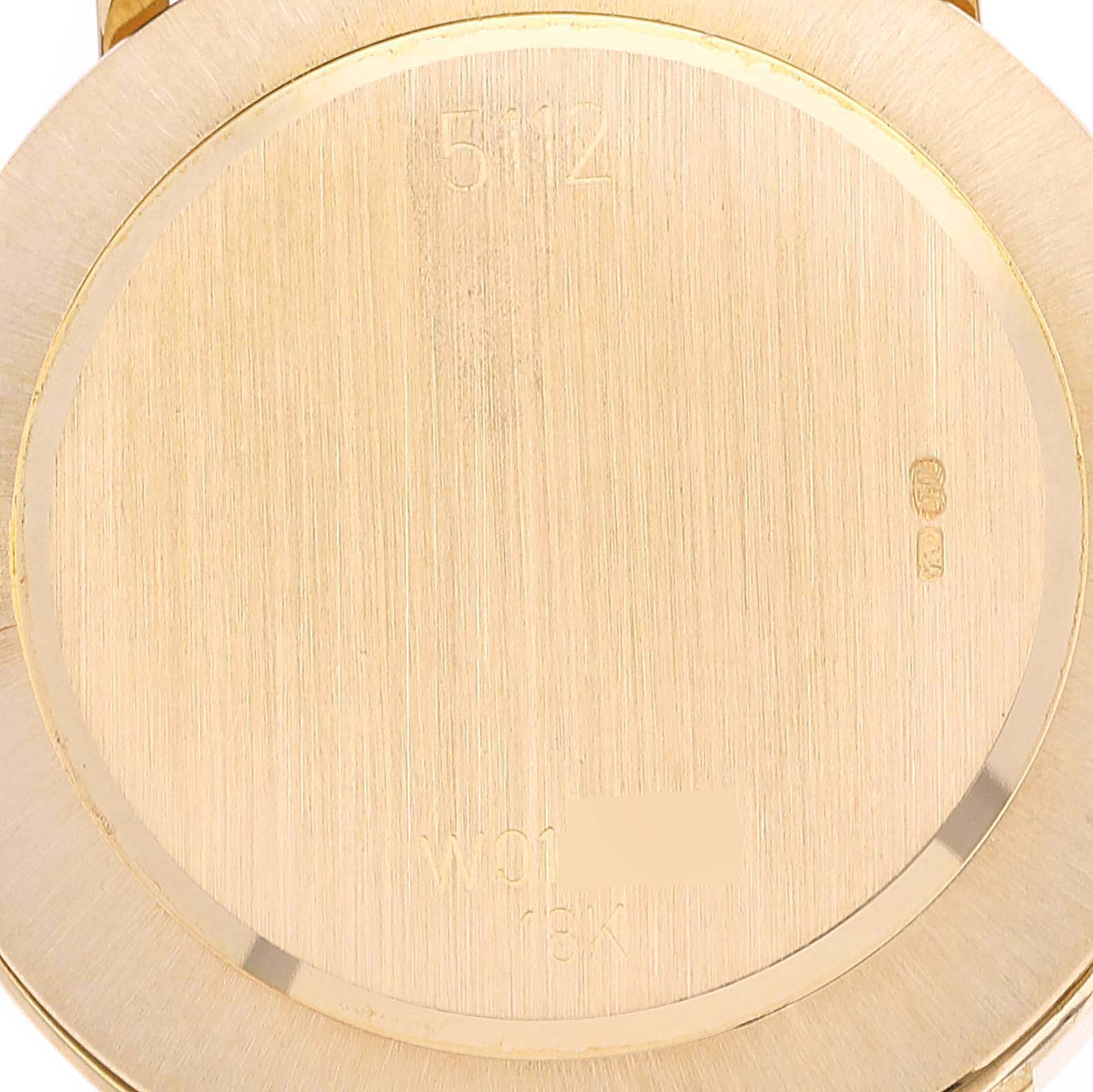 This image shows the back case of a Rolex Cellini 5112 Men's Yellow Gold Beige Dial 5112 Men's Yellow Gold Beige Dial watch, viewed from a direct overhead angle.